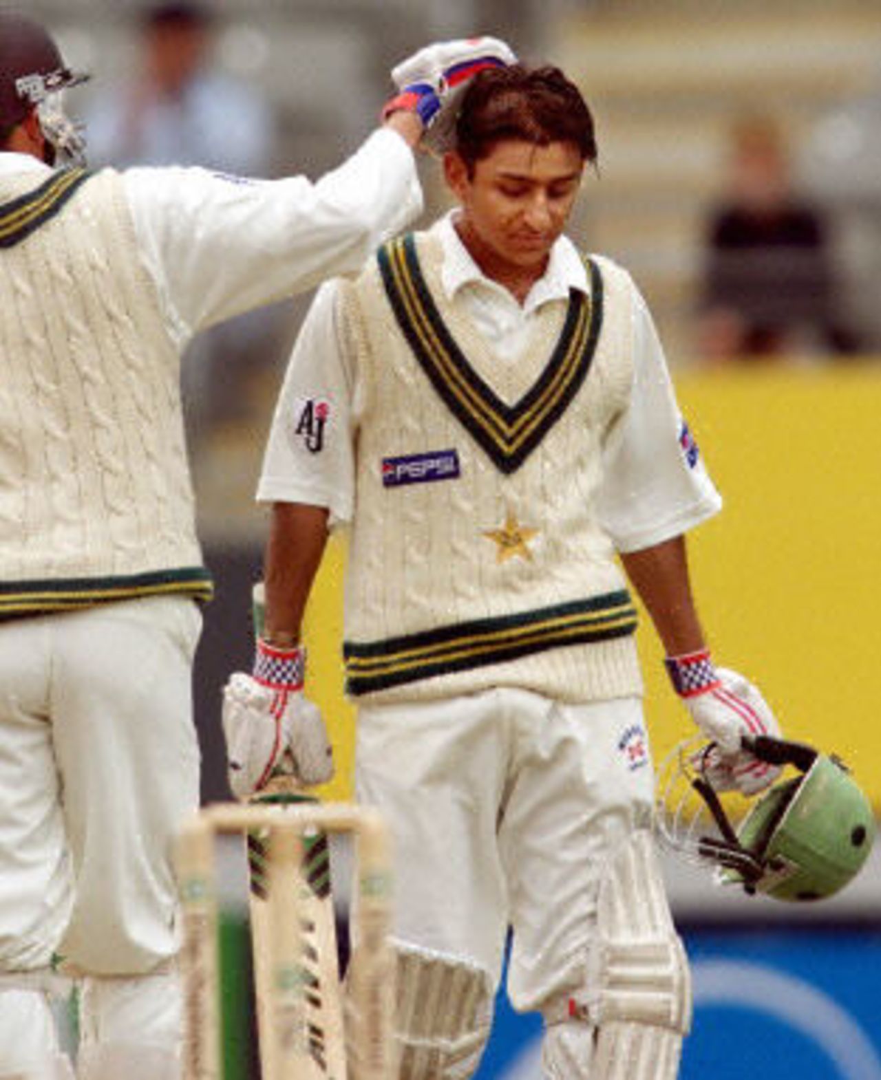 Faisal Iqbal is congratulated by Younis Khan after scoring his first test half century, day 4, 1st Test at Eden Park in Auckland, 8-12 March 2001.