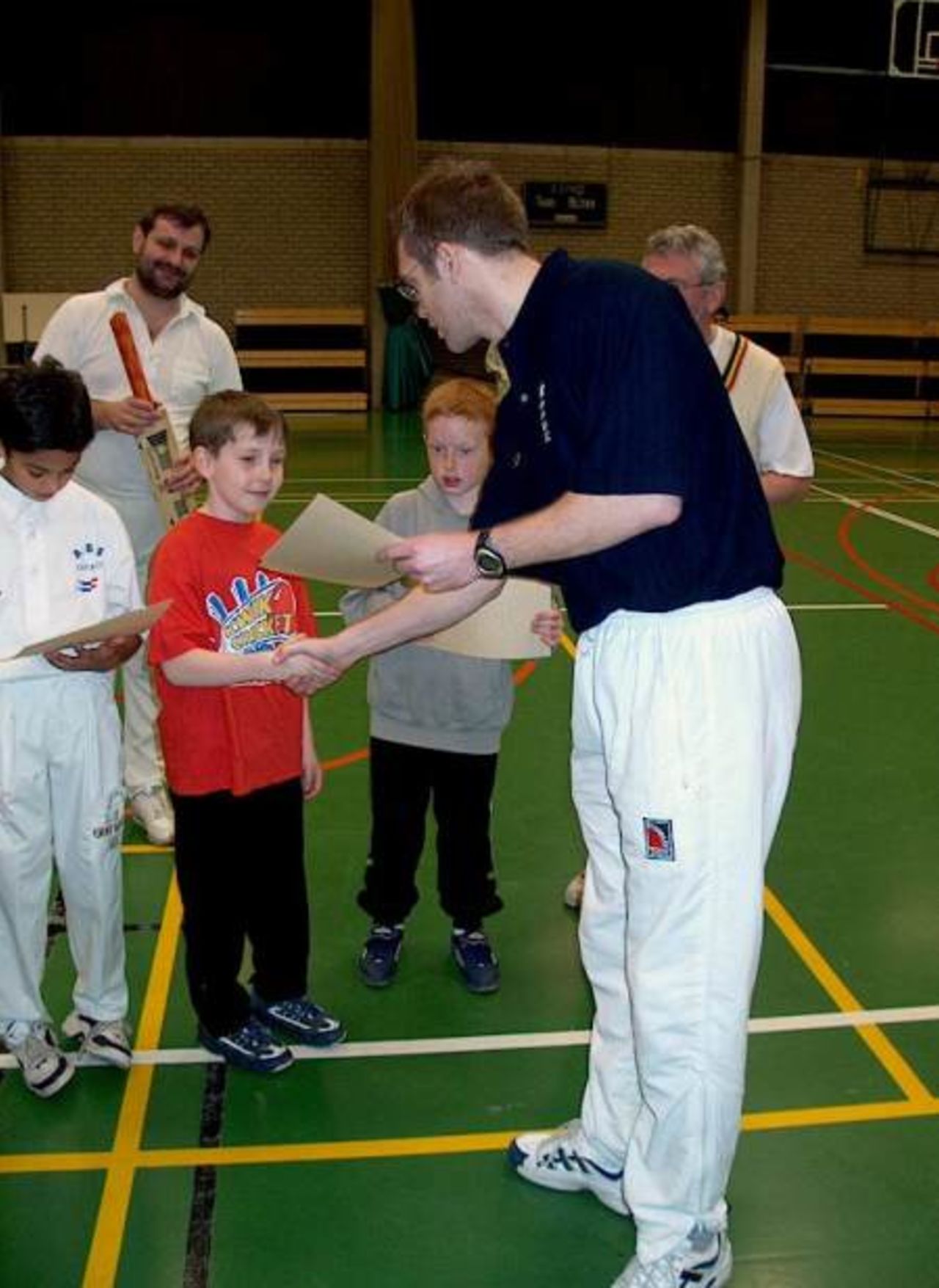 Jens Torf receives his certificate from ECC Coach Stuart Barnes