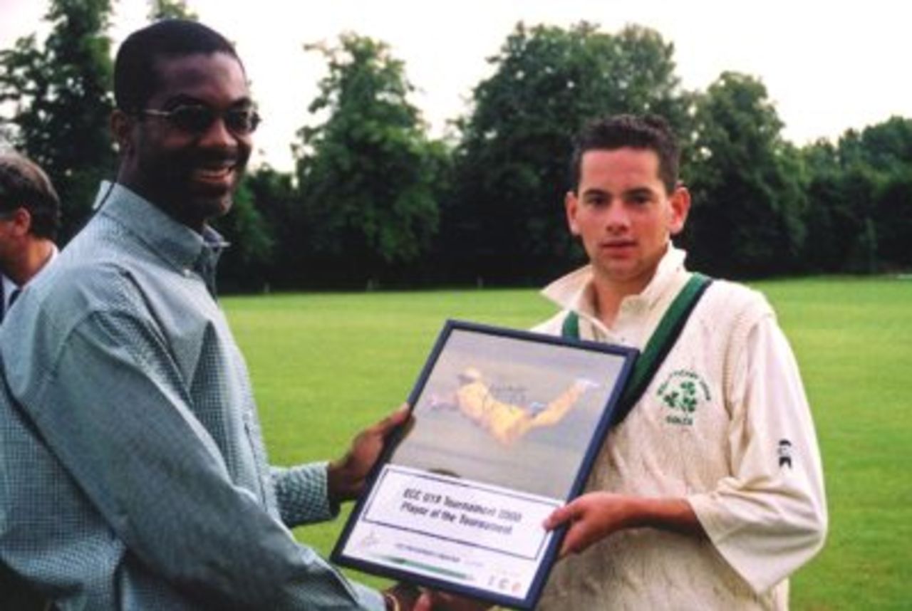 Duncan Smythe of Ireland receives the Player of the Tournament award from West Indian fast bowler Michael Holding