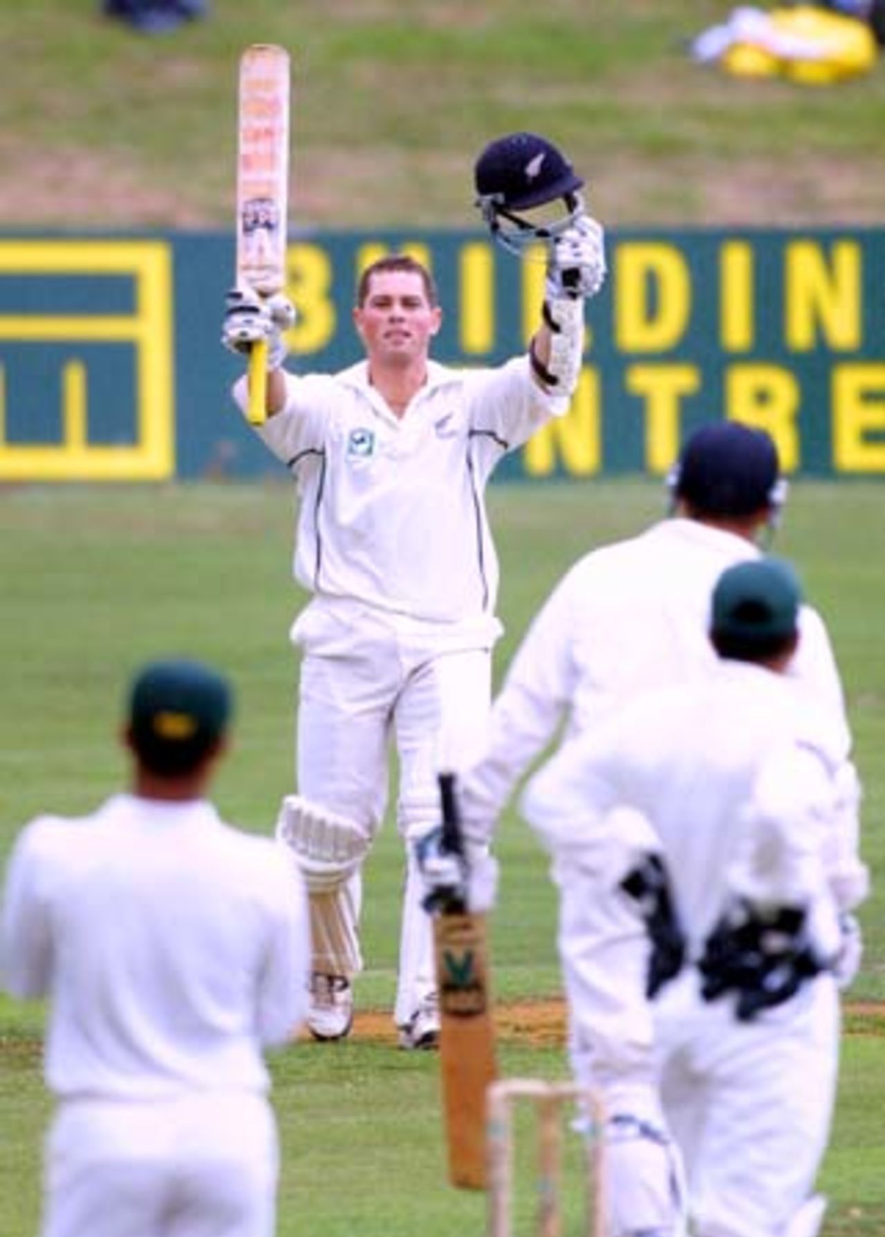 New Zealand opening batsman Matthew Bell raises his bat and helmet in celebration of reaching his maiden Test century. Bell went on to score 105 in the first innings. 3rd Test: New Zealand v Pakistan at WestpacTrust Park, Hamilton, 27-31 March 2001 (Day 3).