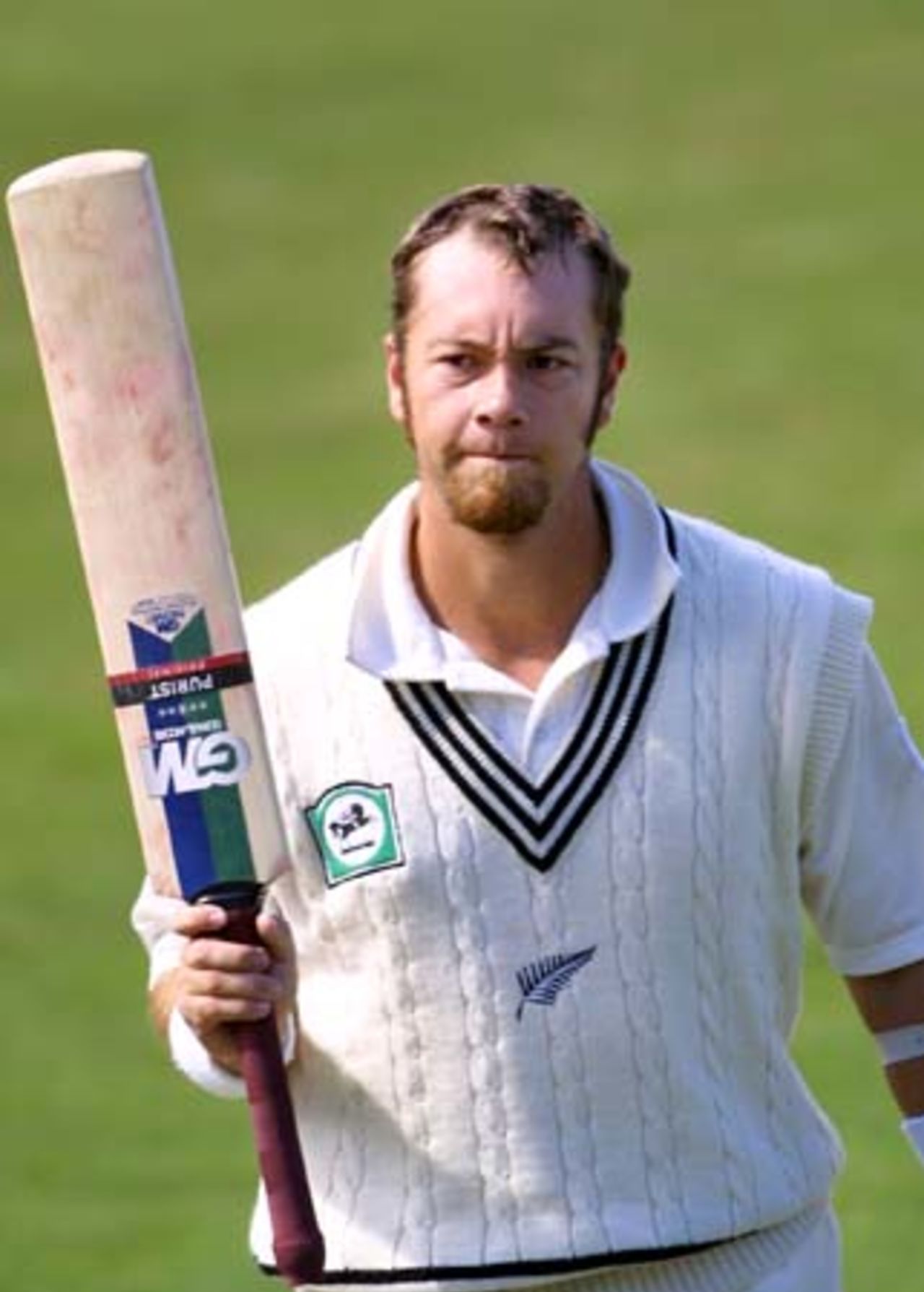 New Zealand batsman Craig McMillan raises his bat to the crowd in acknowledgement of his innings, though in frustration as he was dismissed for 98, caught by Pakistan fielder Waqar Younis just inside the third man boundary off the bowling of fast medium bowler Fazl-e-Akbar. 3rd Test: New Zealand v Pakistan at WestpacTrust Park, Hamilton, 27-31 March 2001 (Day 4).