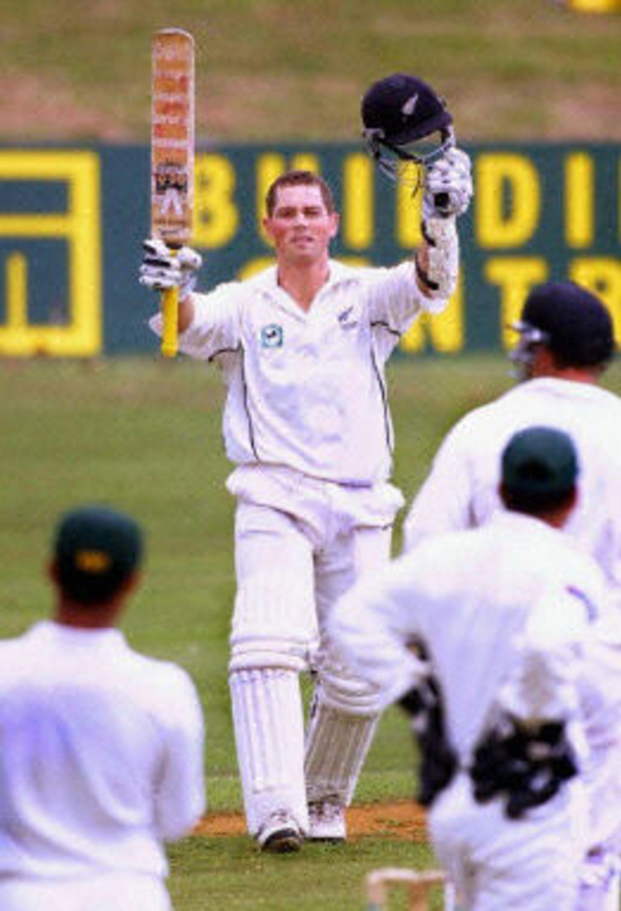 Matthew Bell raises his arms in triumph after scoring his first Test century, day 3, third Test, Hamilton 30 March 2001.