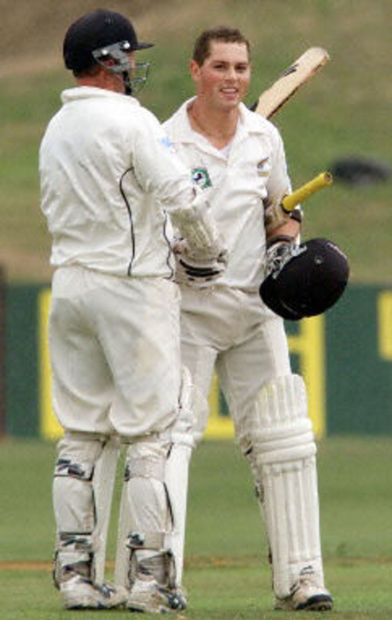 Matthew Bell is congratulated by Mark Richardson after scoring his first Test century, day 3, third Test, Hamilton 30 March 2001.