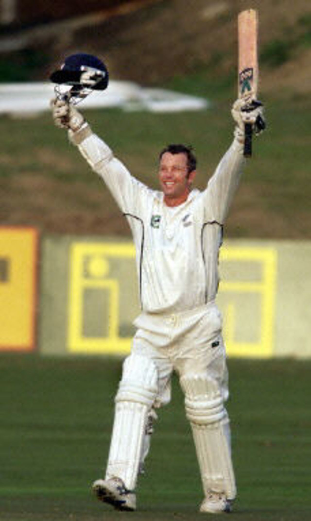 Mark Richardson raises his arms in triumph after scoring his century, day 3, third Test, Hamilton 30 March 2001.