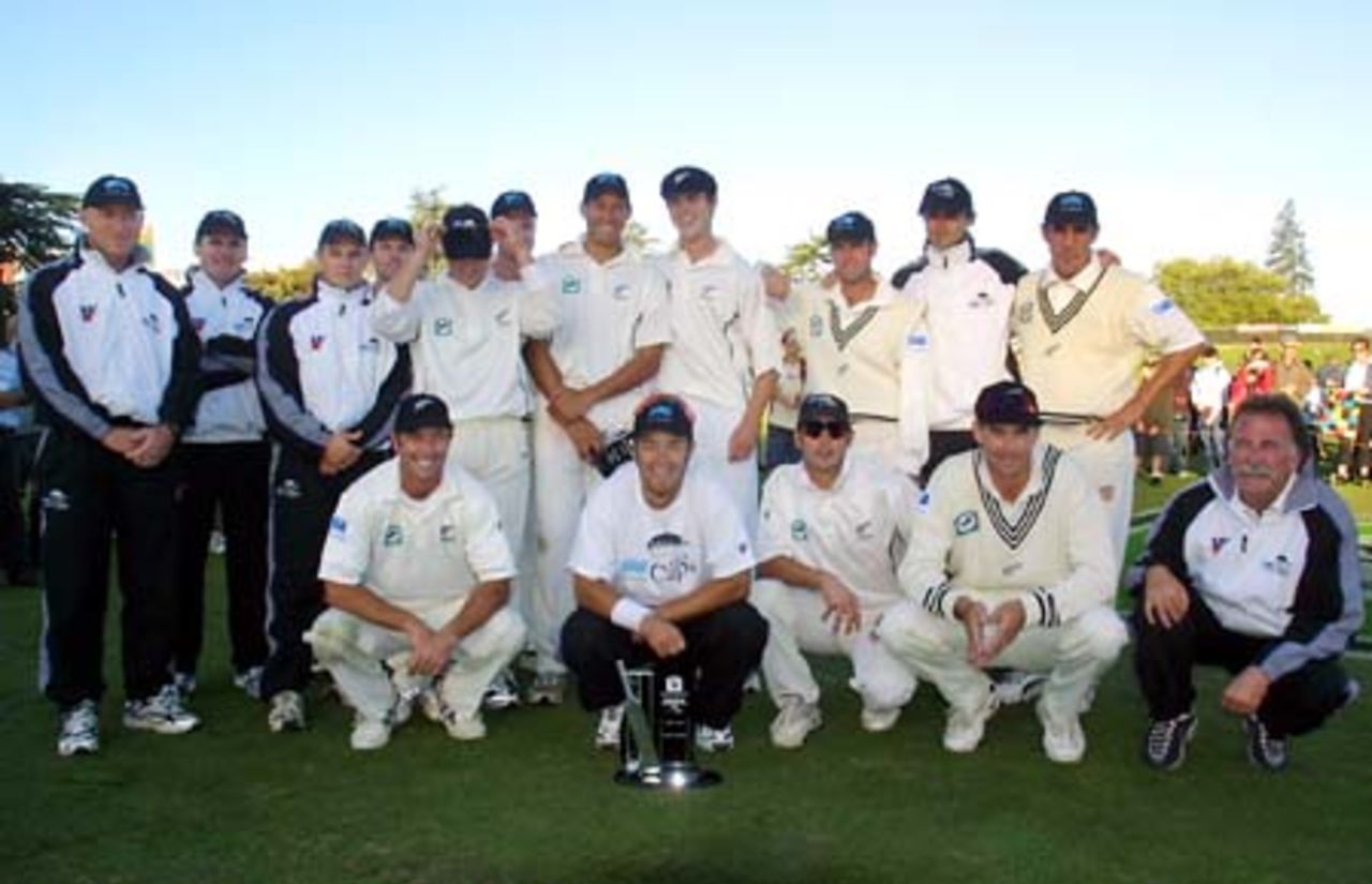 The New Zealand team after completing an innings and 185 run victory over Pakistan to draw the three-Test series 1-1. It is the largest winning margin by New Zealand and the largest defeat for Pakistan in their respective Test histories. Back (from left): manager Jeff Crowe, video analyst Zach Hitchcock, physiotherapist Mark Harrison, replacement 12th man Lou Vincent, Matthew Bell, Grant Bradburn (obscured), Daryl Tuffey, James Franklin, Nathan Astle, Chris Martin, Mathew Sinclair. Front: Mark Richardson, Craig McMillan (with the National Bank International Cricketer of the Year Award), Adam Parore, captain Stephen Fleming and coach David Trist. 3rd Test: New Zealand v Pakistan at WestpacTrust Park, Hamilton, 27-31 March 2001 (Day 4).