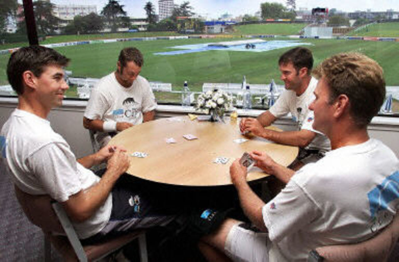 Stephen Fleming enjoys a game of cards with Craig McMillan, Nathan Astle and Grant Bradburn as rain washes out play, day 2, third Test, Hamilton 30 March 2001.