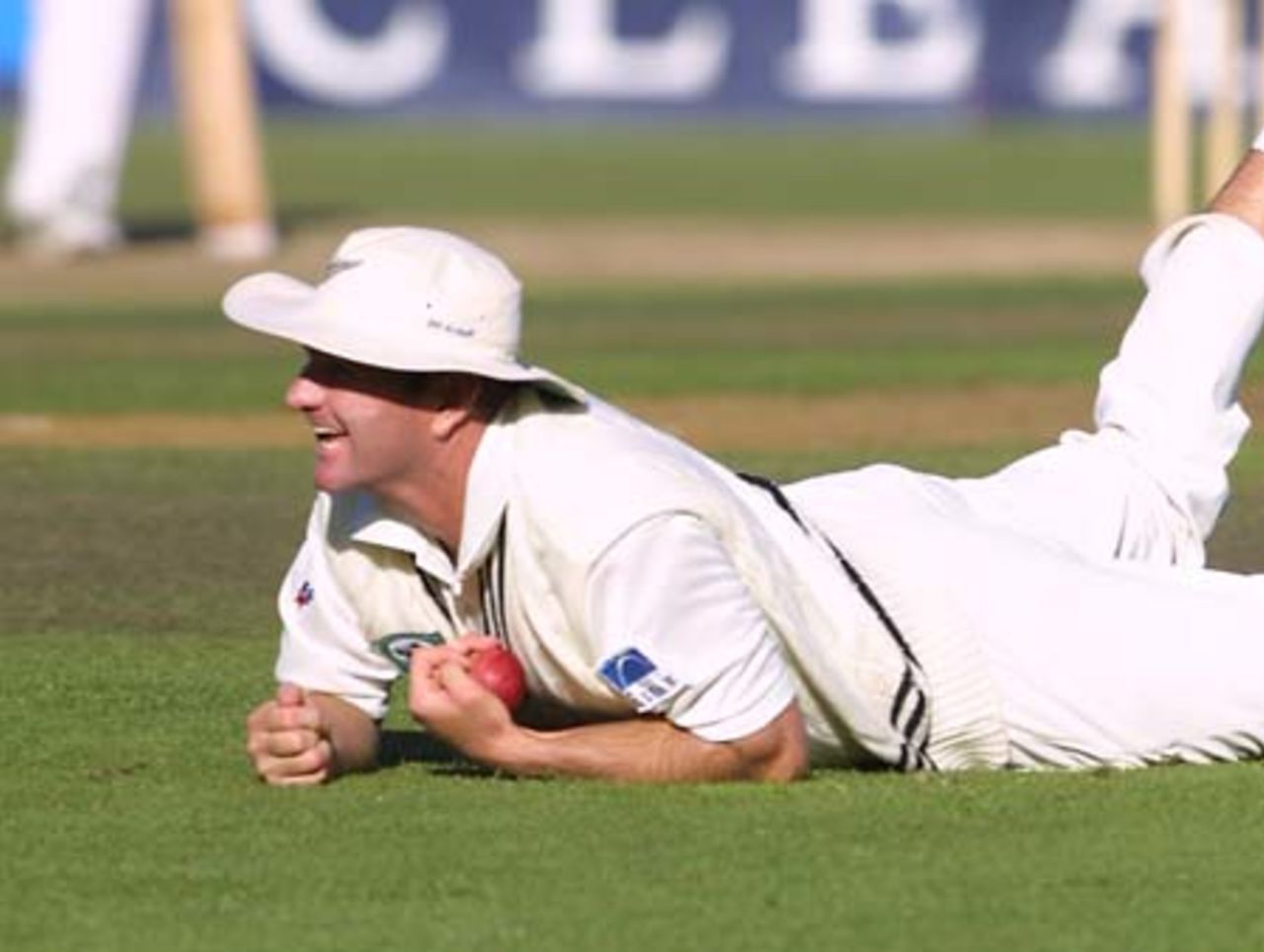 New Zealand fielder Grant Bradburn smiles after completing a diving catch to his left at gully to dismiss Pakistan batsman Humayun Farhat in his second innings, caught off the bowling of fast medium bowler Chris Martin for 26. 3rd Test: New Zealand v Pakistan at WestpacTrust Park, Hamilton, 27-31 March 2001 (Day 4).