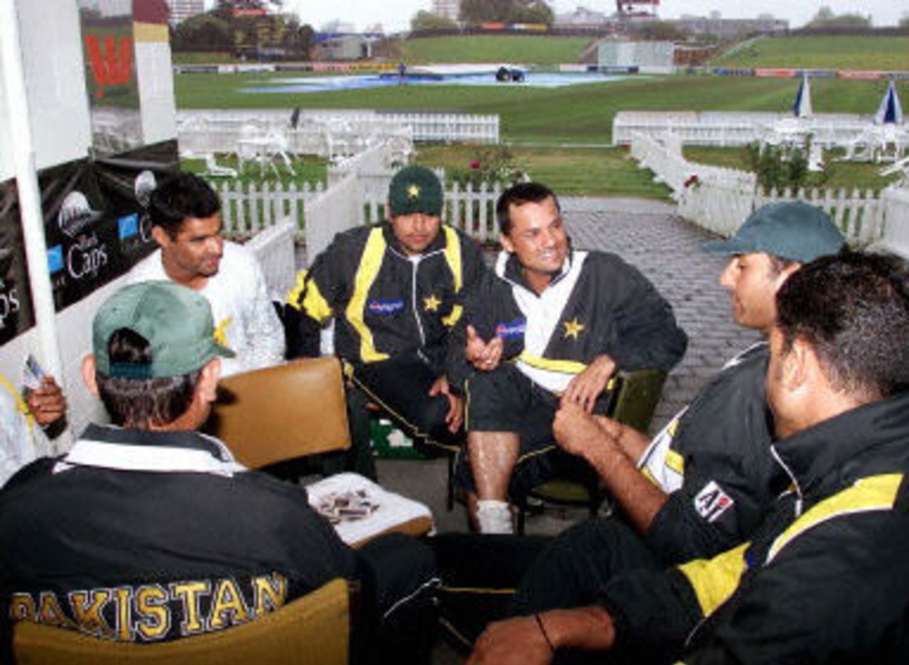 Members of the Pakistan cricket team enjoy a game of cards as rain washes out play, day 2, third Test, Hamilton 30 March 2001.