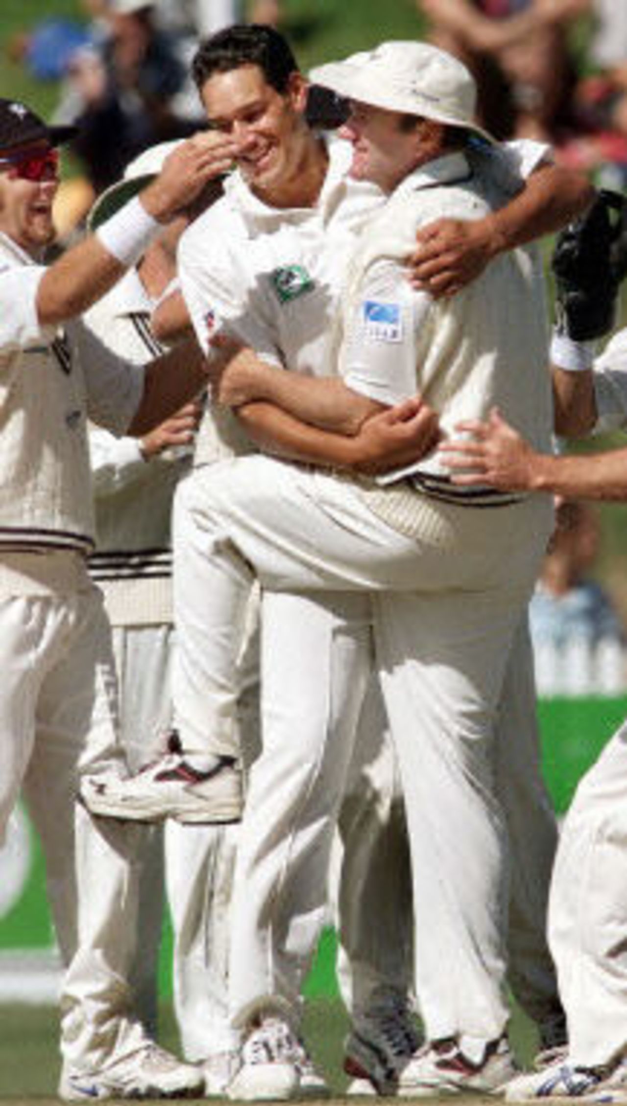 Grant Bradburn celebrates catching Faisal Iqbal with bowler Daryl Tuffey and Craig McMillan, day 4, third Test, Hamilton 30 March 2001.