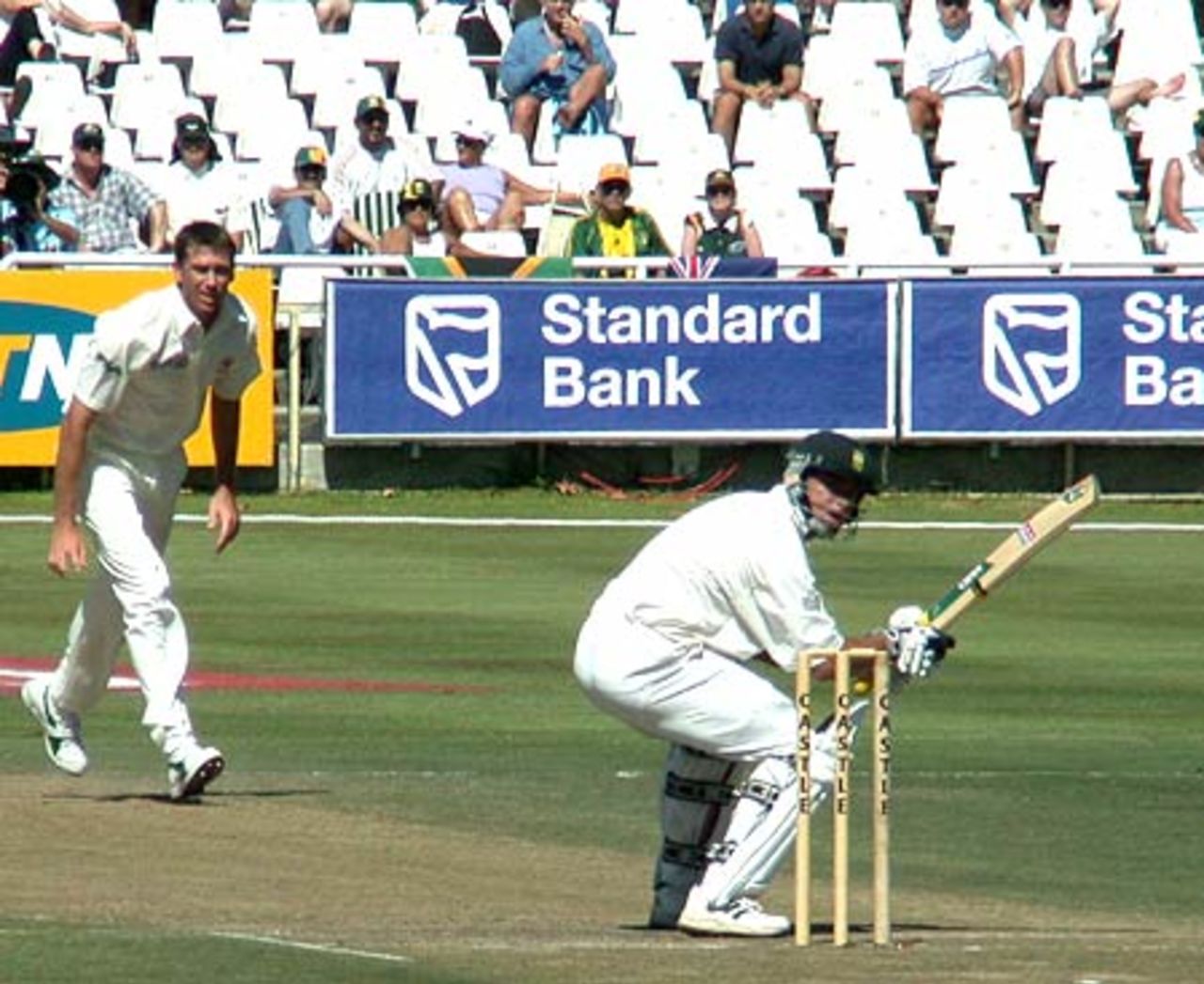 Herschelle Gibbs ducks under a Glen McGrath bouncer