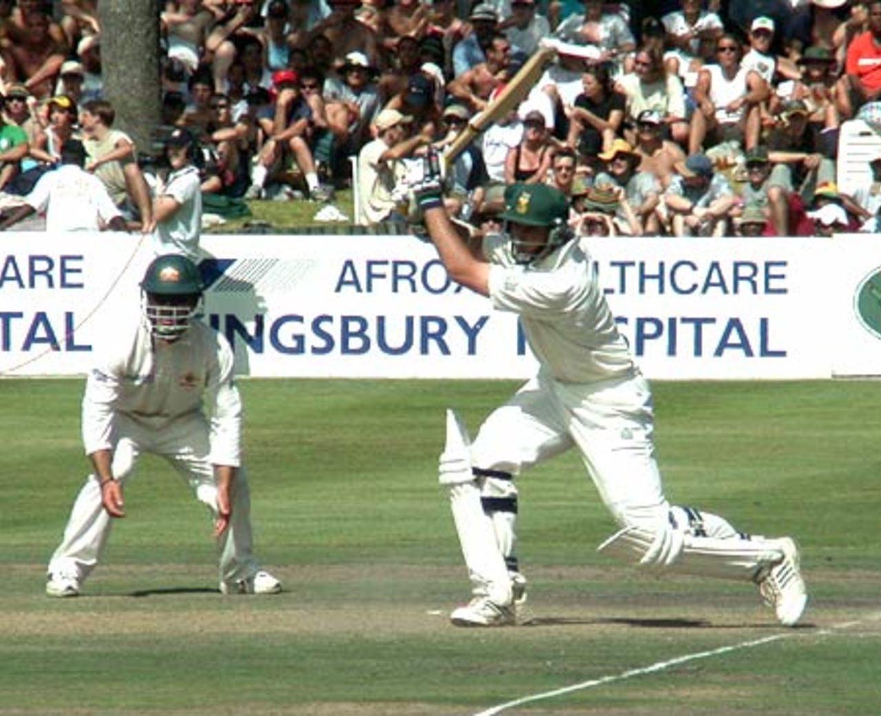 Graeme Smith drives through the covers as shortleg Ricky Ponting looks on