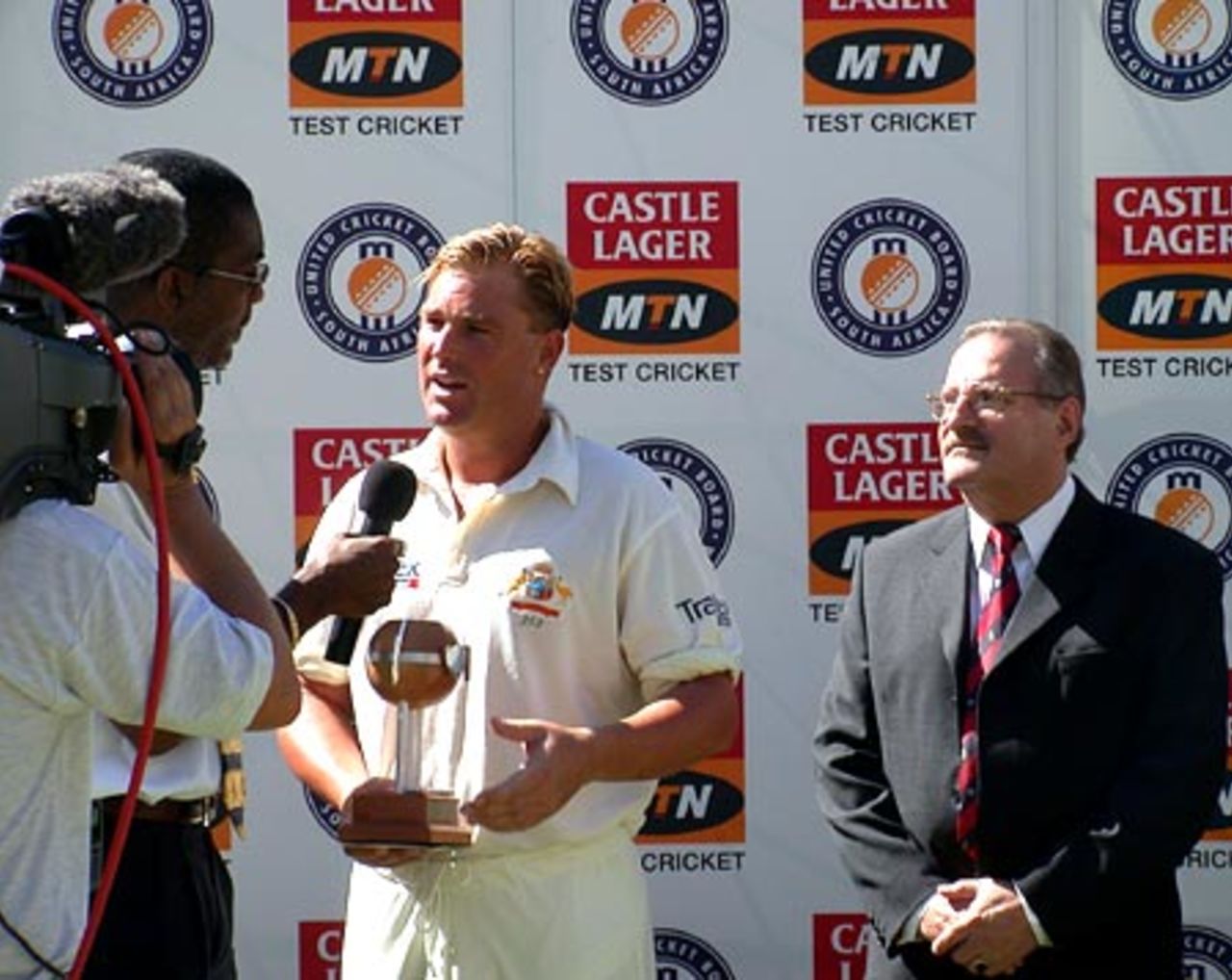 Shane Warne is interviewed by Michael Holding with WP President Arnold Bloch looking on