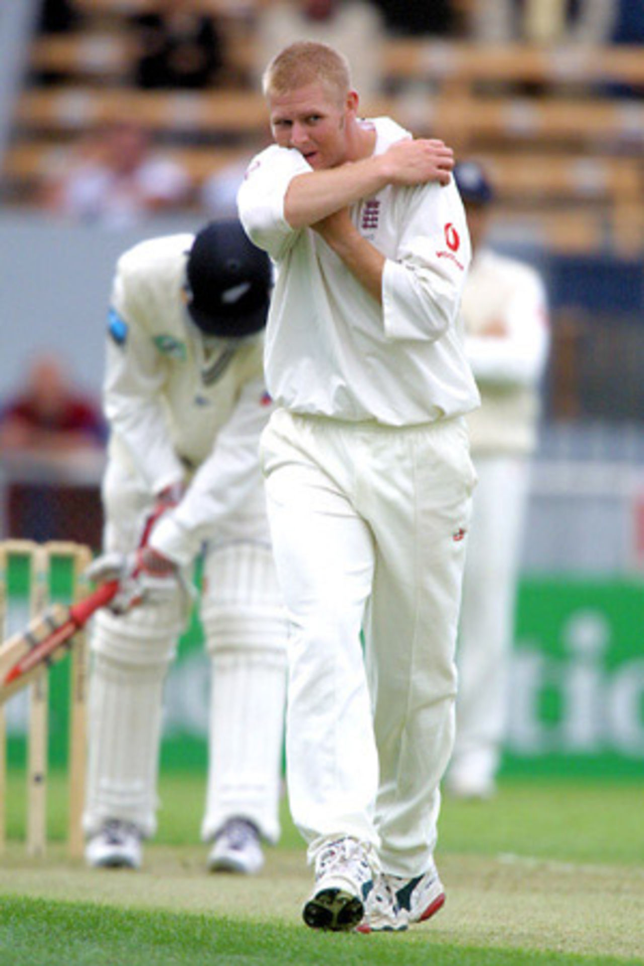 England bowler Matthew Hoggard returns to his mark after delivering a ball to New Zealand batsman Daniel Vettori during his first day spell of 1-6 from three overs. 1st Test: New Zealand v England at Jade Stadium, Christchurch, 13-17 March 2002 (13 March 2002).