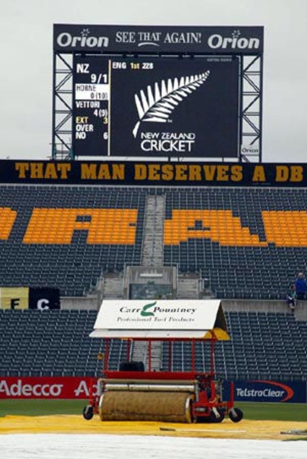 A super-sopper on the outfield in front of the DB Draught Stand with the scoreboard in the background as rain delays the start of play on day two. 1st Test: New Zealand v England at Jade Stadium, Christchurch, 13-17 March 2002 (14 March 2002).