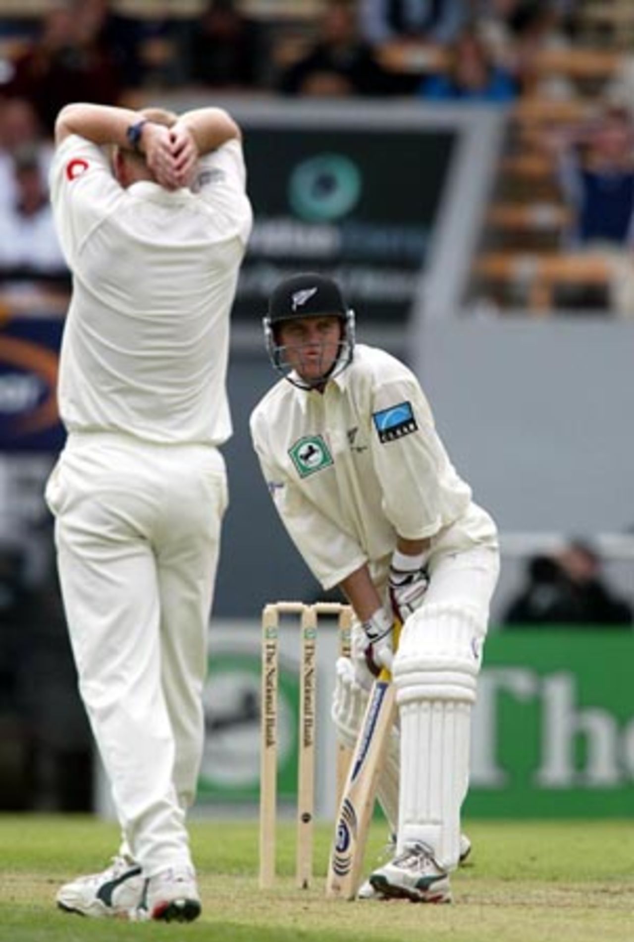 New Zealand batsman Lou Vincent reflects on a lucky escape from his first delivery faced while England bowler Matthew Hoggard anguishes with hands on head. Vincent went on to score 12 in his first innings. 1st Test: New Zealand v England at Jade Stadium, Christchurch, 13-17 March 2002 (14 March 2002).