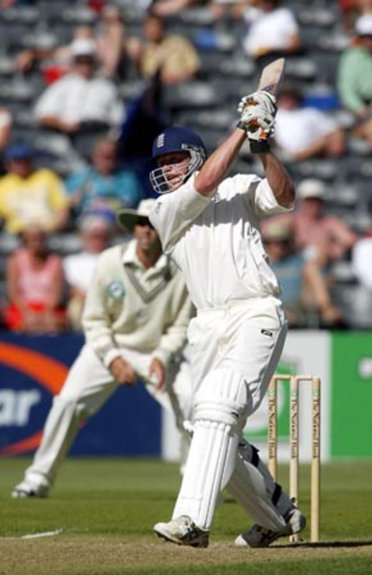 England batsman Andrew Flintoff drives a delivery from New Zealand bowler Craig McMillan down the ground to the boundary during his innings of 137. 1st Test: New Zealand v England at Jade Stadium, Christchurch, 13-17 March 2002 (15 March 2002).