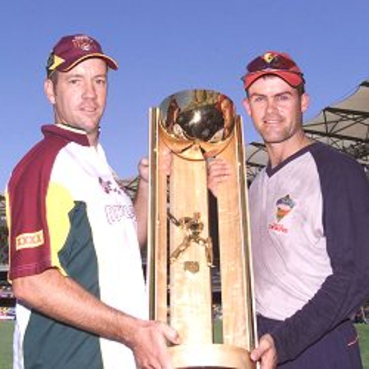 21 Mar 2002: Stuart Law of the Bulls and Jamie Cox of the Tigers pose for a photograph with the Pura Cup Trophy to be contested between the Queensland Bulls and the Tasmania Tigers at the Gabba, Brisbane, Australia.