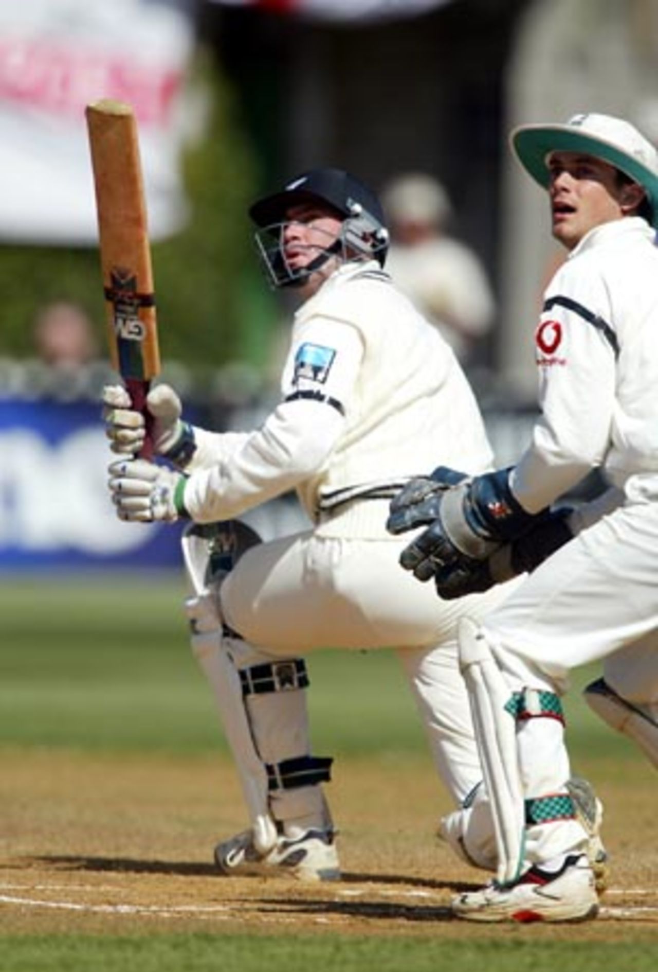 New Zealand batsman Matt Horne sweeps a delivery from England bowler Ashley Giles as wicket-keeper James Foster looks on. Horne scored 38 in his second innings. 2nd Test: New Zealand v England at Basin Reserve, Wellington, 21-25 March 2002 (25 March 2002).