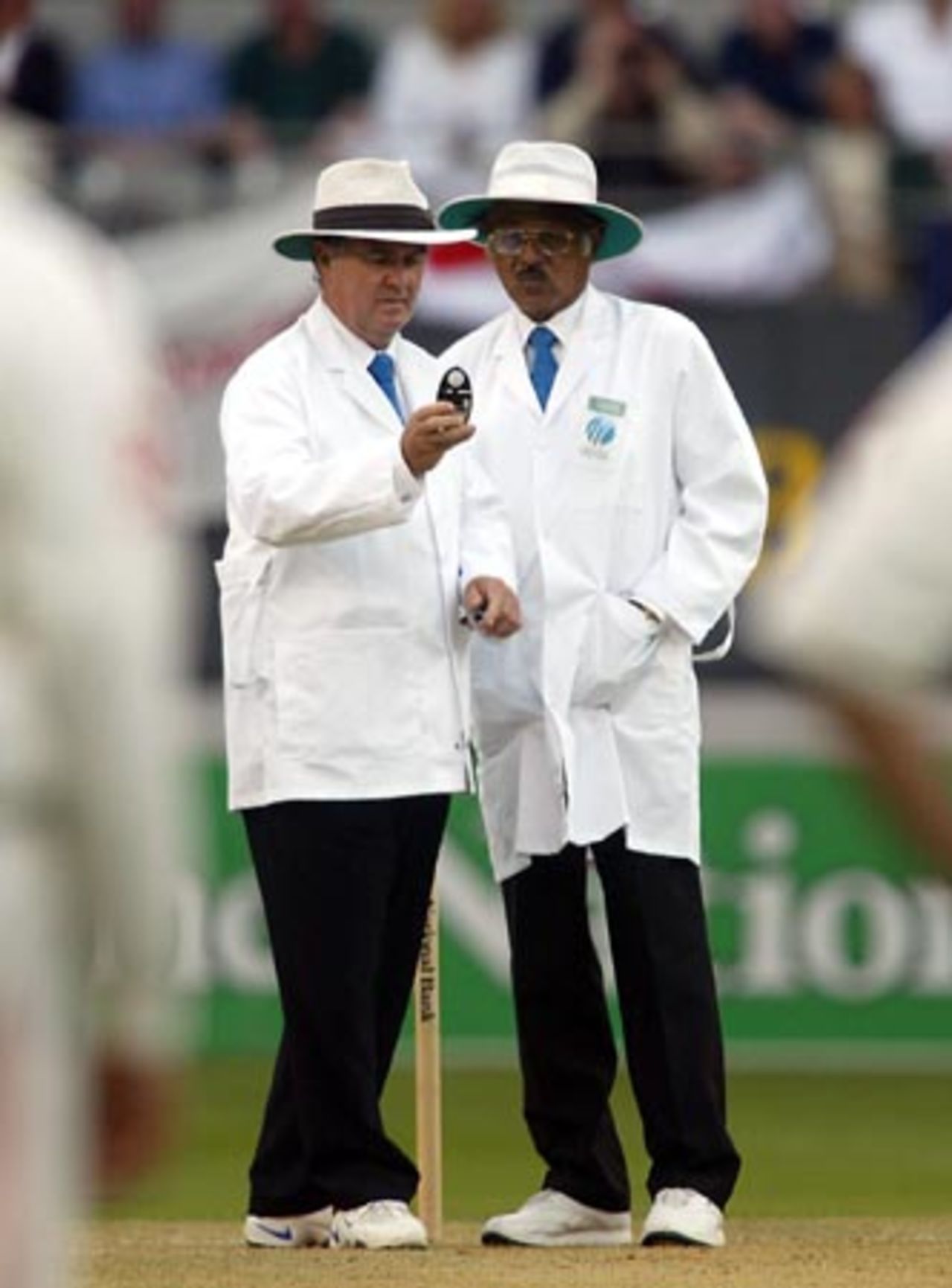 Umpires Doug Cowie (left) and Srinivas Venkataraghan from India check the light. It was subsequently offered to the New Zealand batsmen who accepted and the first day's play ended after conditions failed to improve. 3rd Test: New Zealand v England at Eden Park, Auckland, 30 March-3 April 2002 (30 March 2002).