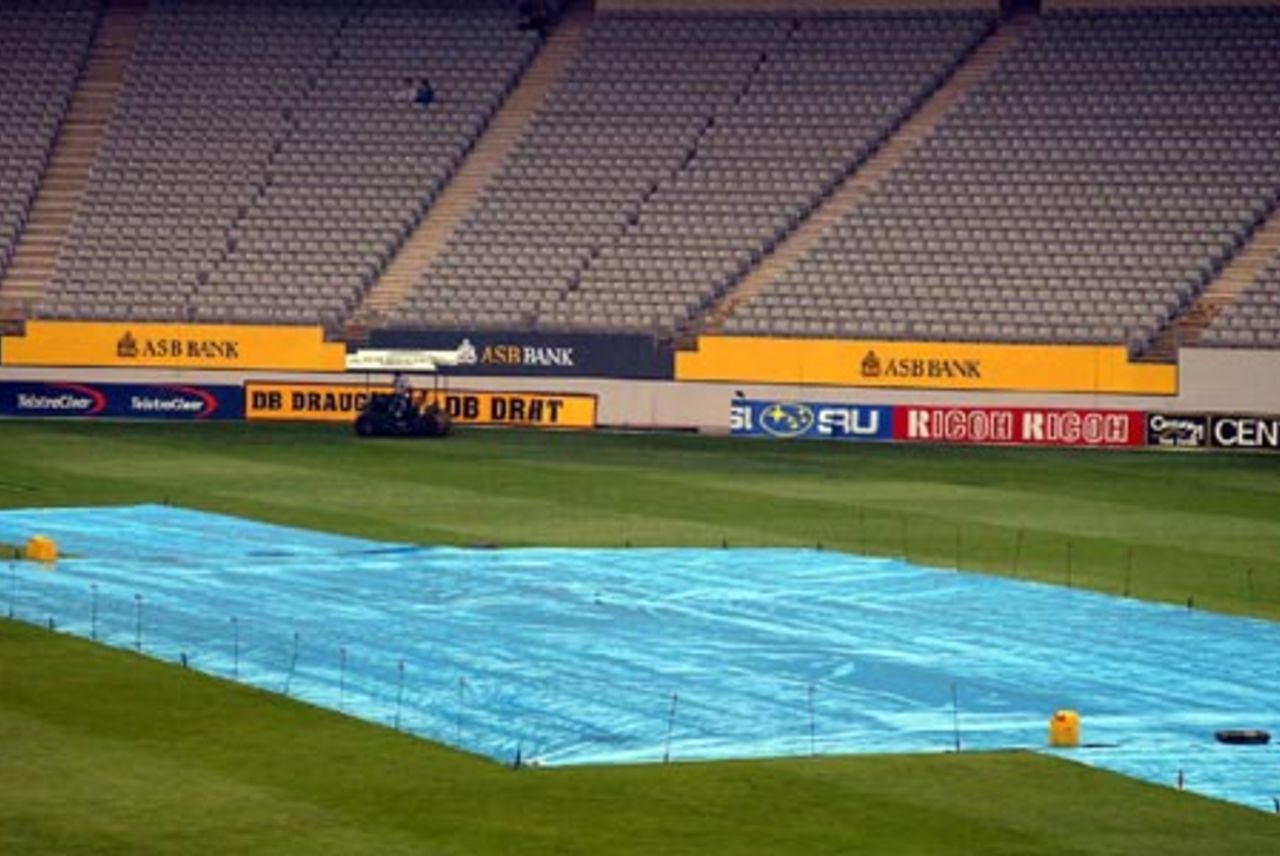 The covers are staked into the ground during a lengthy delay due to rain on the second day. The day was eventually abandoned in the afternoon. 3rd Test: New Zealand v England at Eden Park, Auckland, 30 March-3 April 2002 (31 March 2002).