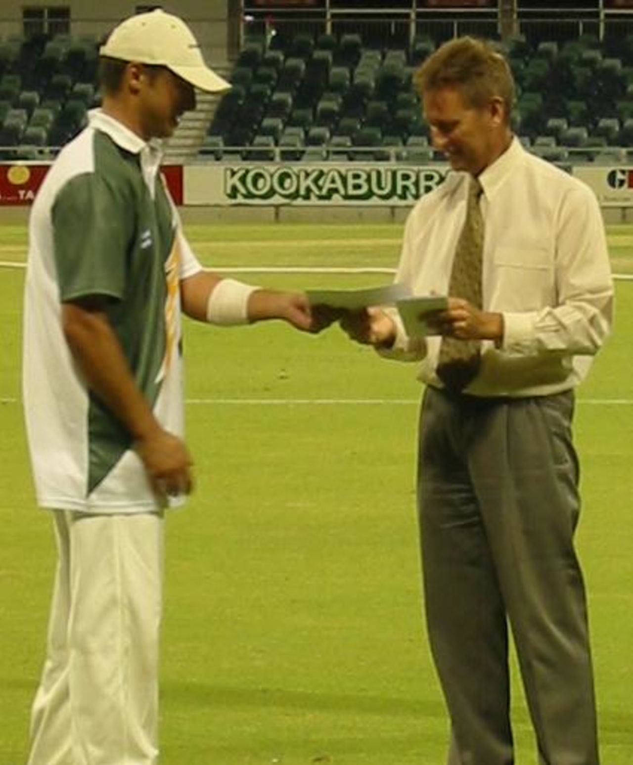 Scarborough batsman Rob Baker accepting a cheque for being the man of the match in the Sunday League final of 2002-03.  Baker scored 132 runs from 138 balls with 19 fours.