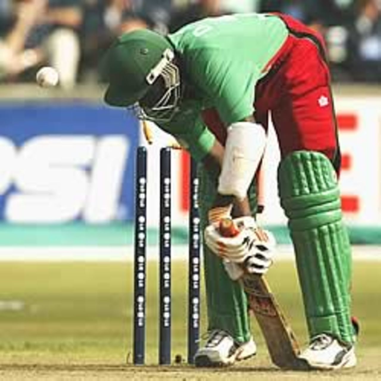DURBAN- MARCH 15: David Obuya of Kenya is bowled by Brett Lee of Australia to complete a hat trick, the first wicket of a hat trick during the World Cup Super Six One Day International between Australia and Kenya played at Kingsmead, Durban, South Africa, on March 15, 2003.