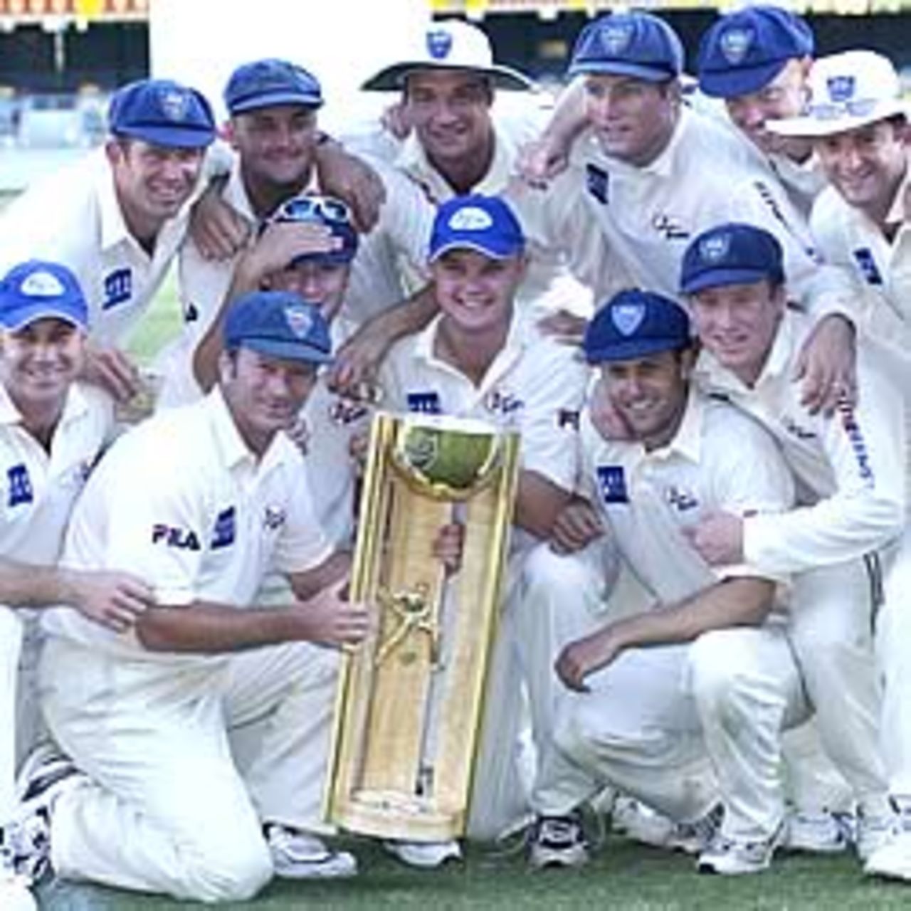 BRISBANE - MARCH 16: The Blues celebrate winning the Pura Cup against the Bulls after the third day of the Pura Cup Final between the Queensland Bulls and the New South Wales Blues at the Gabba in Brisbane, Australia on March 16, 2003.