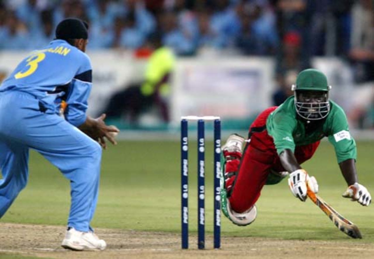 Sourav Ganguly hits a shot as Kenya's wicketkeeper Kennedy Obuya looks on, World Cup 2003, 2nd Semi Final - India v Kenya at Durban, 20 March 2003