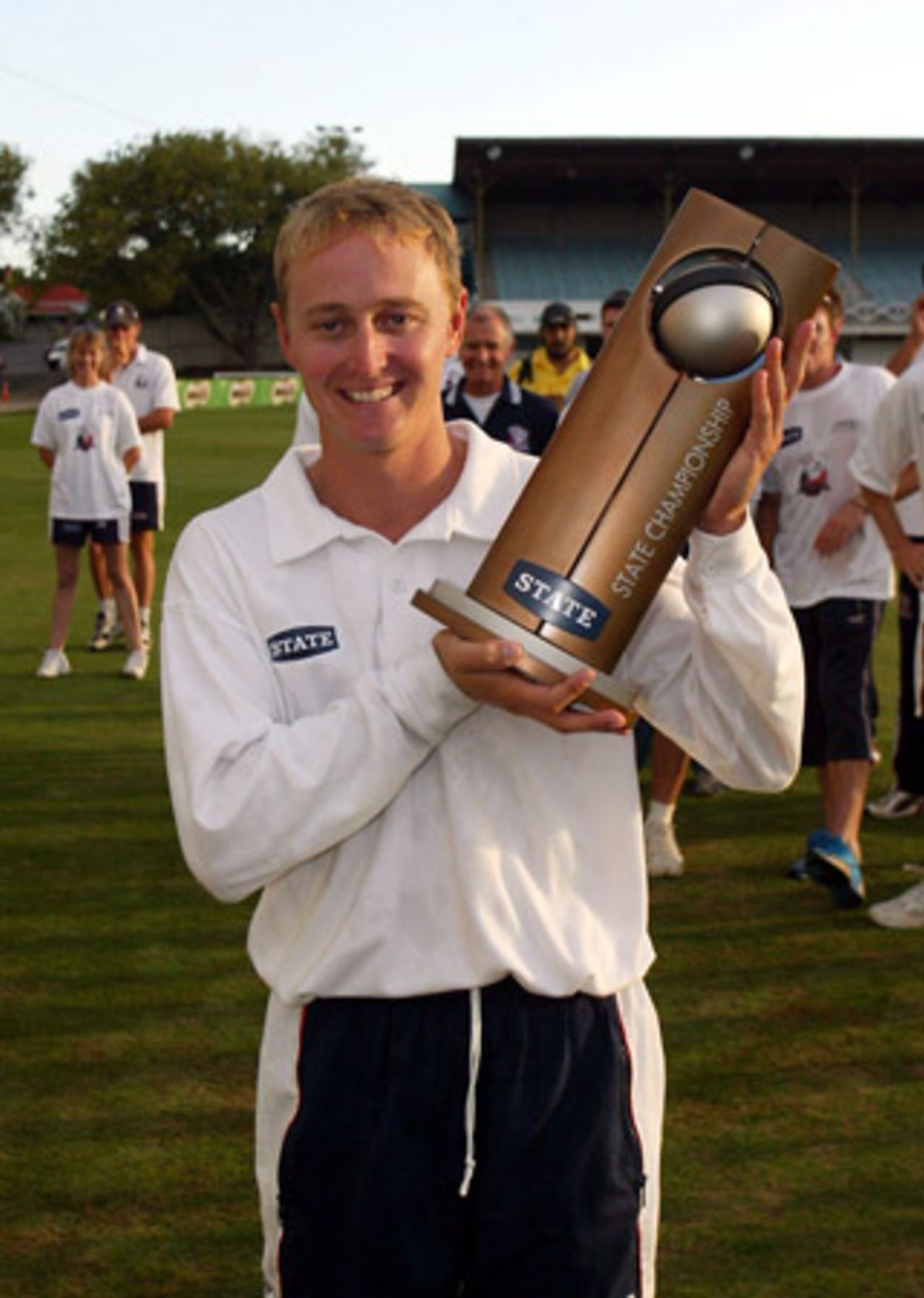 Winning Auckland captain Brooke Walker holds the 2002/03 State Championship trophy. State Championship: Auckland v Northern Districts at Eden Park Outer Oval, Auckland, 17-20 March 2003 (20 March 2003).