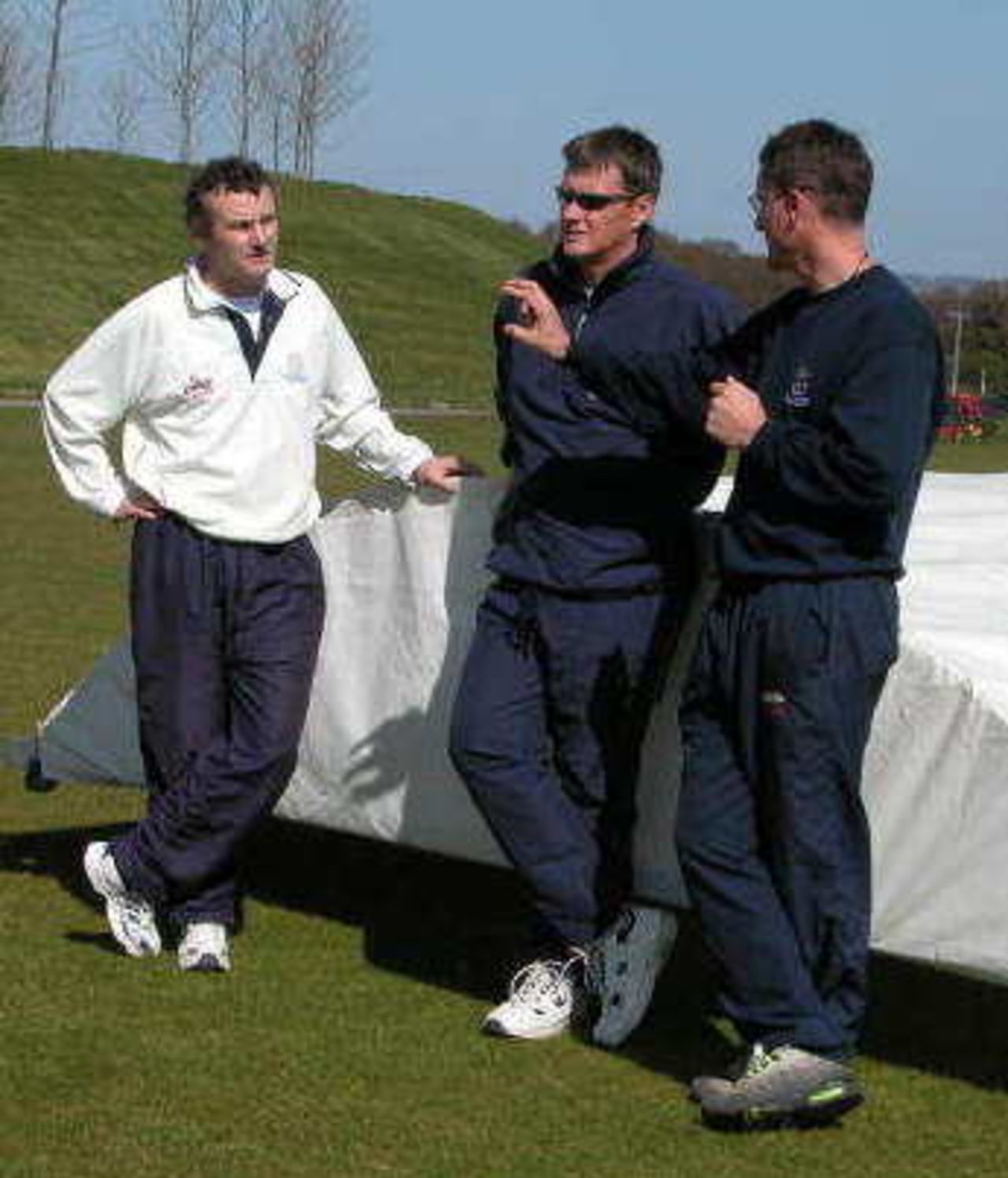From left to right Tony Middleton, Paul Terry and Giles White reviewing net practise.