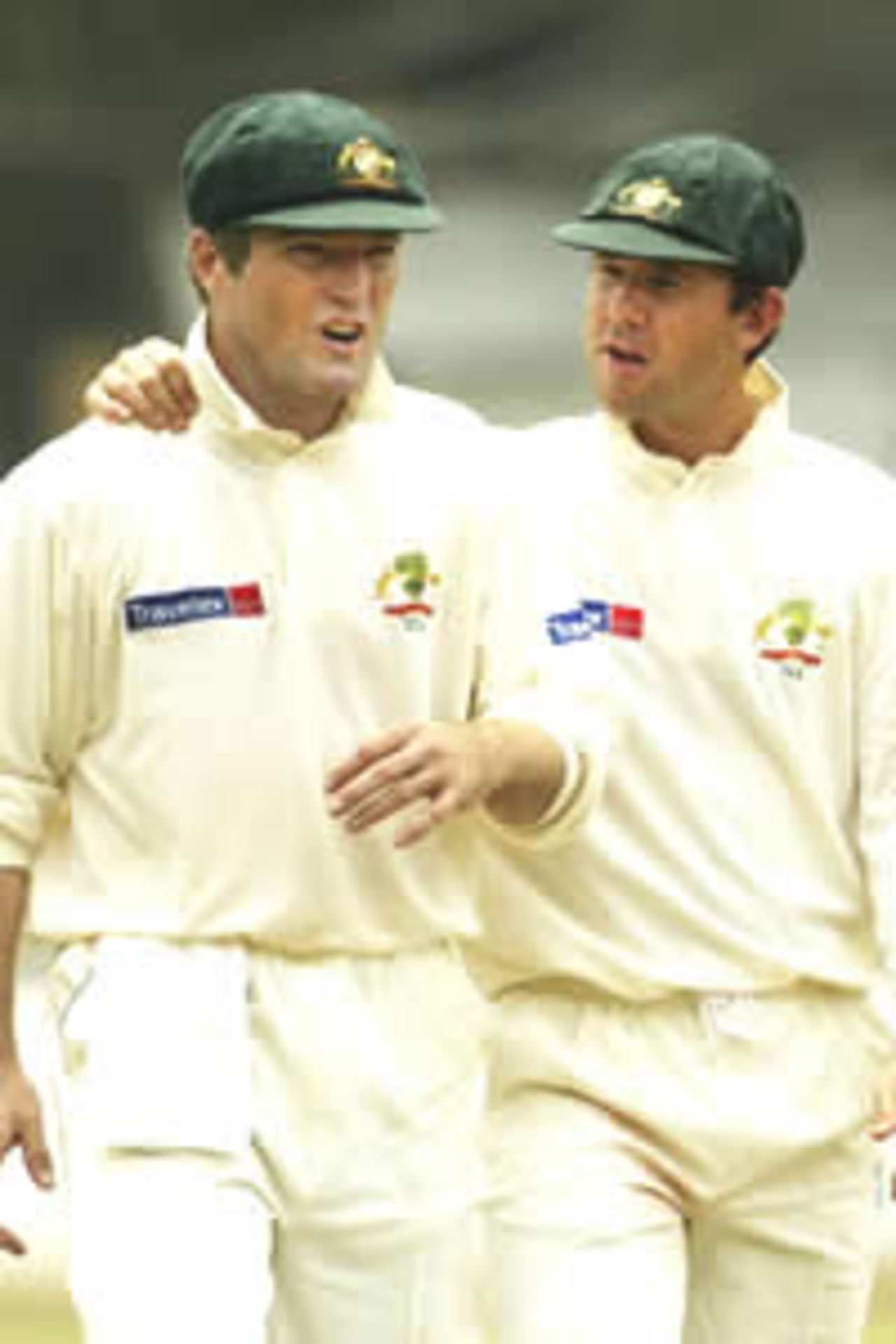 Stuart MacGIll and Ricky Ponting of Australia talk as they leave the field for lunch during day two of the three day Tour Match between Australia and the President's XI played at the Colombo Cricket Club on March 3, 2004 in Colombo, Sri Lanka