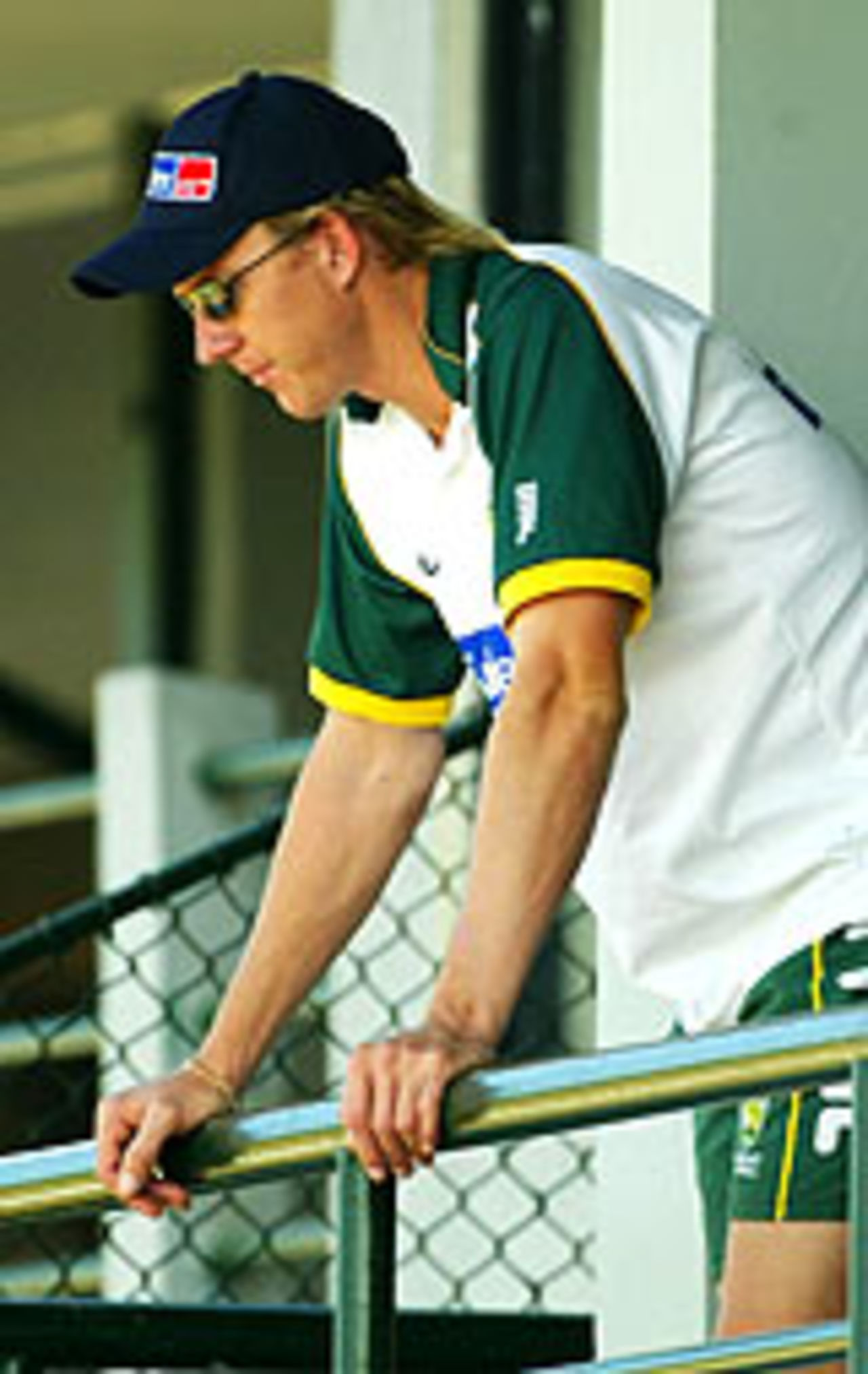 Brett Lee watches his team-mates practicing before the 1st Test match, Galle, March 6, 2004