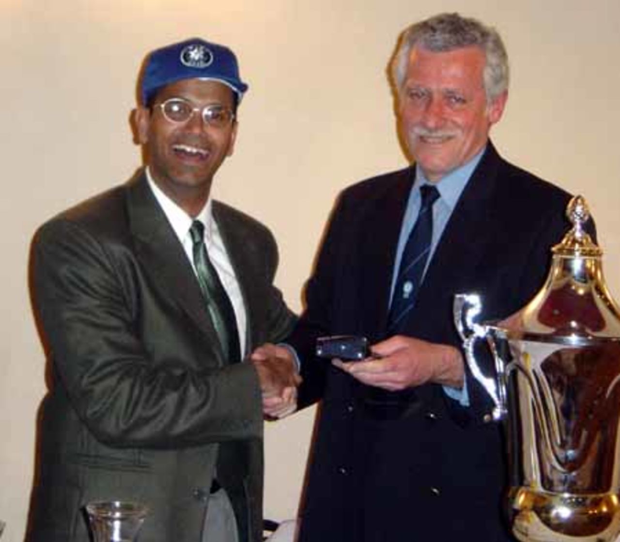 First Secretary of the Indian Embassy, Mr. Das, is presented with an ICA tie and Israel cricket cap by ICA Chairman Stanley Perlman.