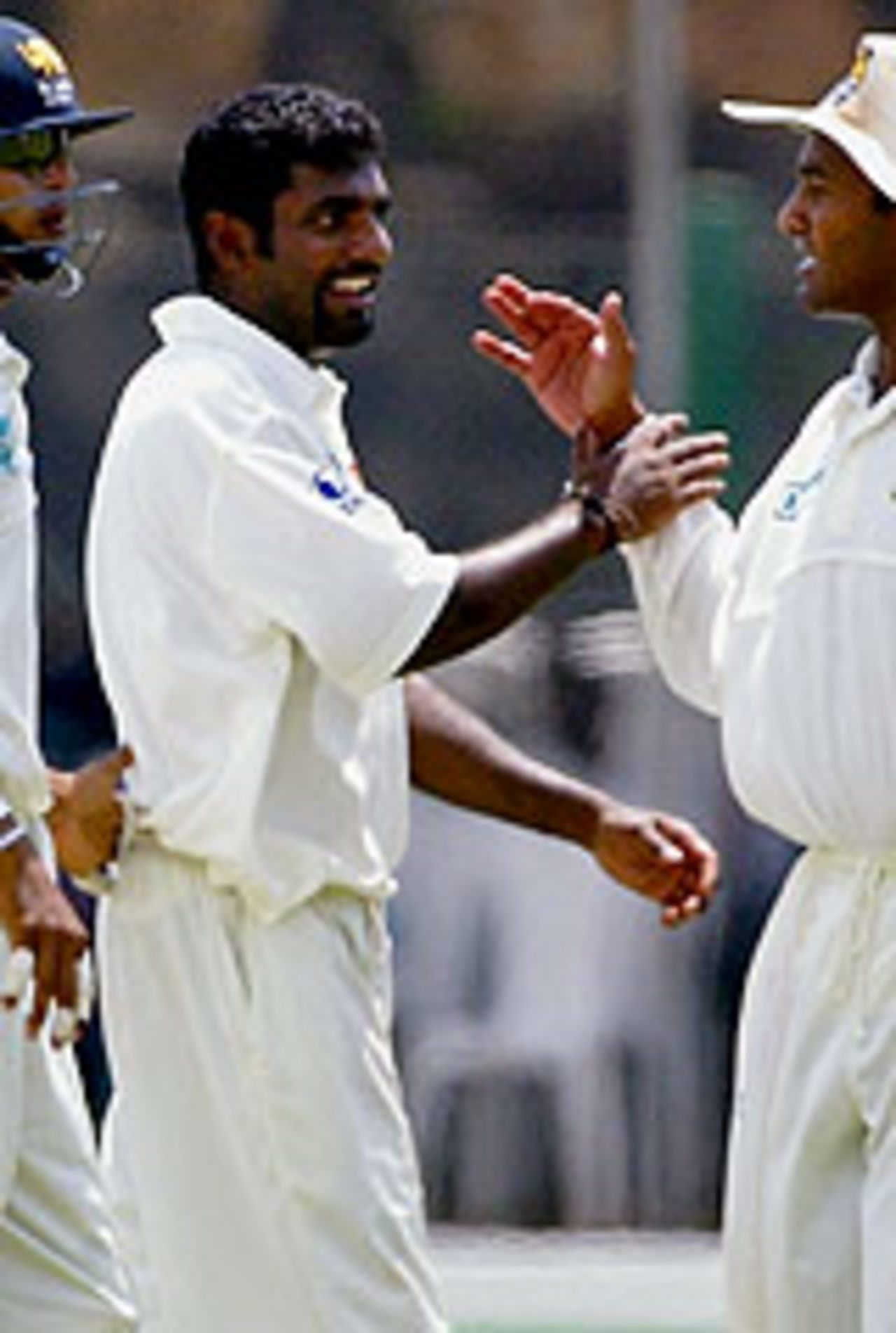 Muttiah Muralitharan smiles after getting rid of Andrew Symonds, Sri Lanka v Australia, 1st Test, Galle, 1st day, March 8, 2004