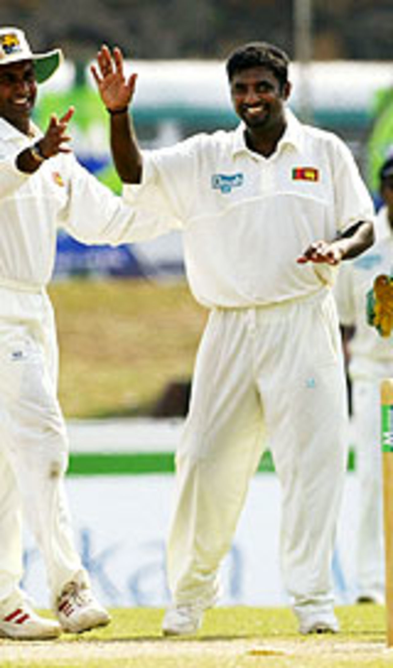Muttiah Muralitharan's got that smile again, and it can't be good for Australia, Sri Lanka v Australia, 1st Test, Galle, 1st day, March 8, 2004