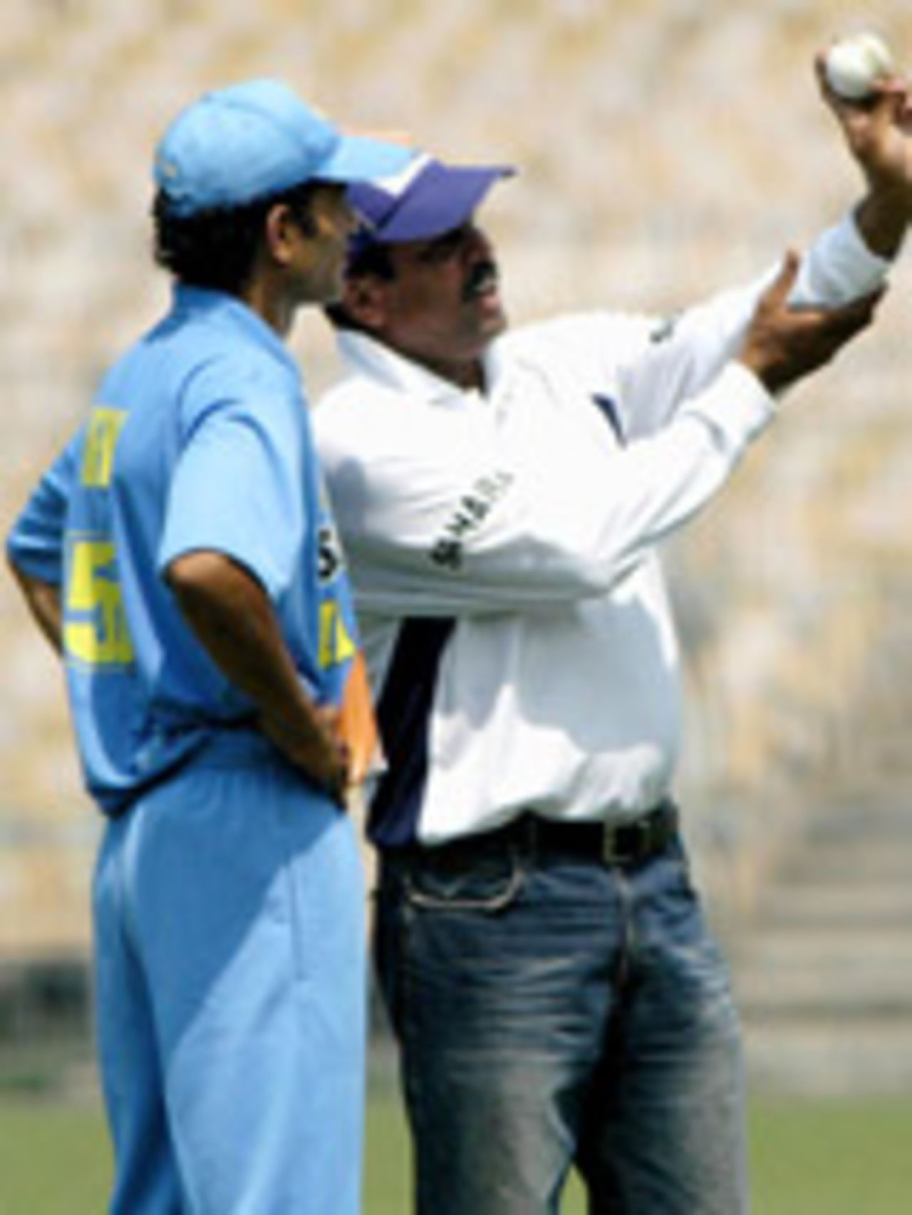 Kapil Dev advises Irfan Pathan during the training camp, Calcutta, March 8, 2004