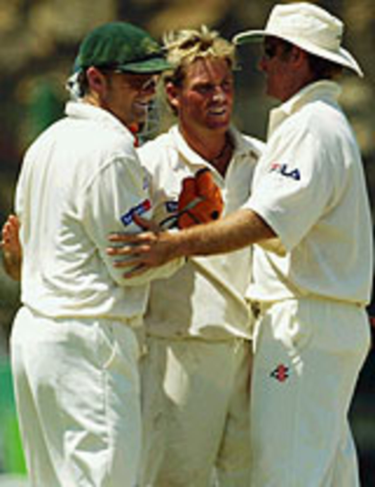 Shane Warne is congratulated by his team-mates after the wicket of Upul Chandana, Sri Lanka v Australia, 3rd Test, Galle, 3rd day, March 10, 2004