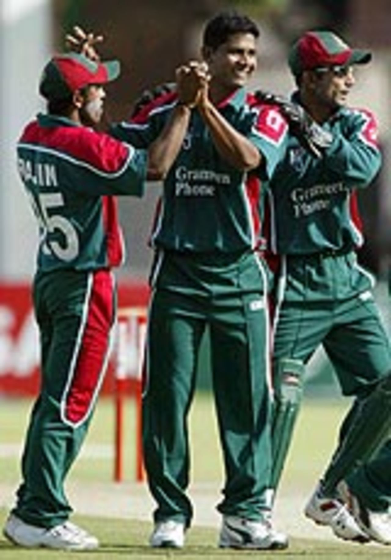 Mushfiqur Rahman celebrates with his team-mates, Bangladesh v Zimbabwe, 3rd ODI, Harare
