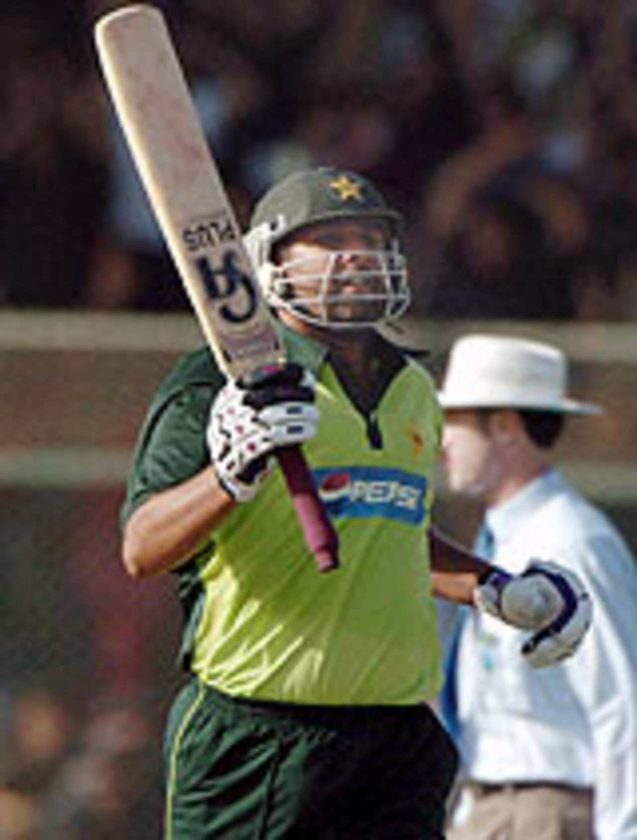 Inzamam-ul-Haq raises his bat after reaching his century, Pakistan v India, 1st ODI, Karachi, March 13, 2004