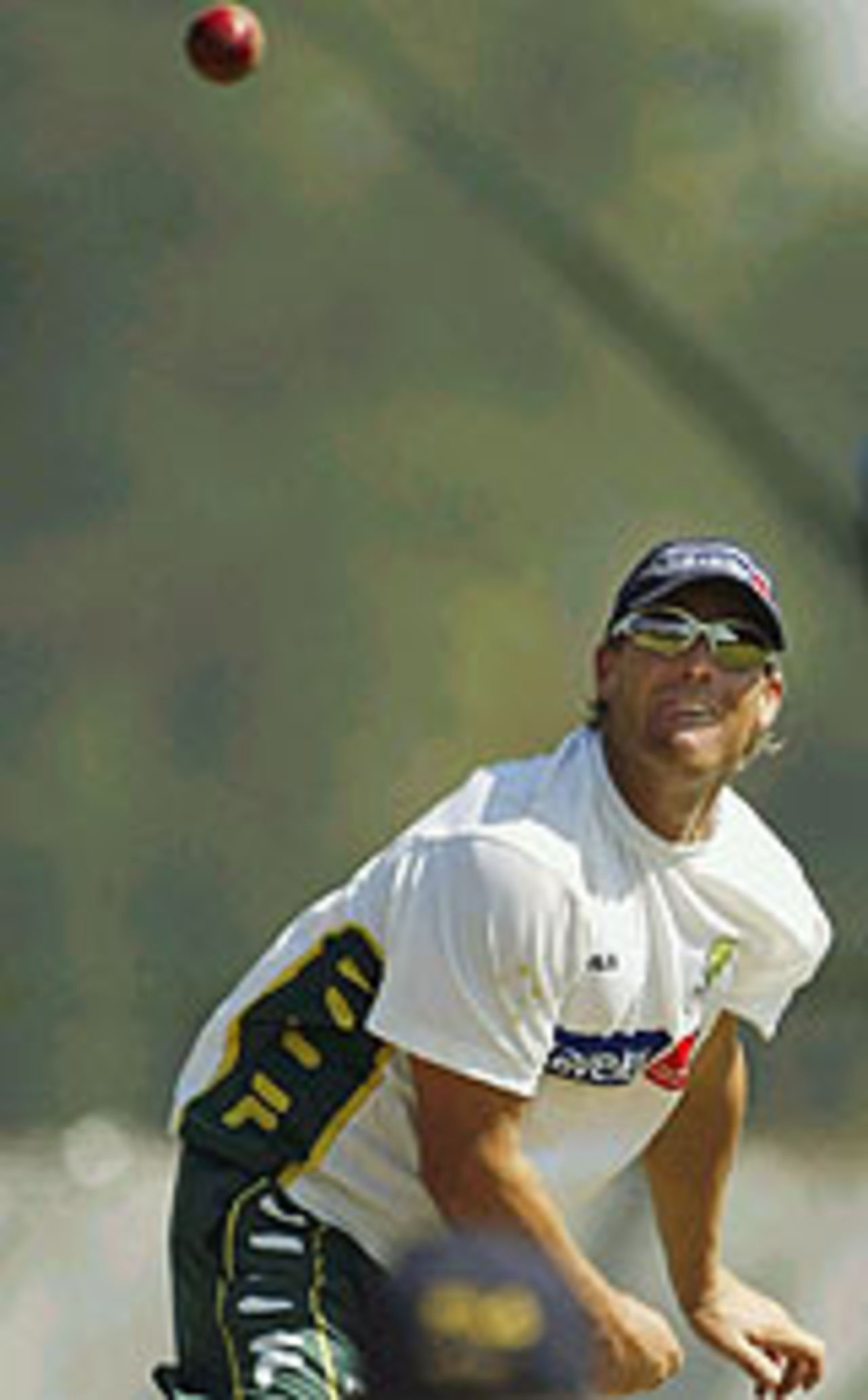 Shane Warne bowls in the nets at Kandy, March 14, 2004