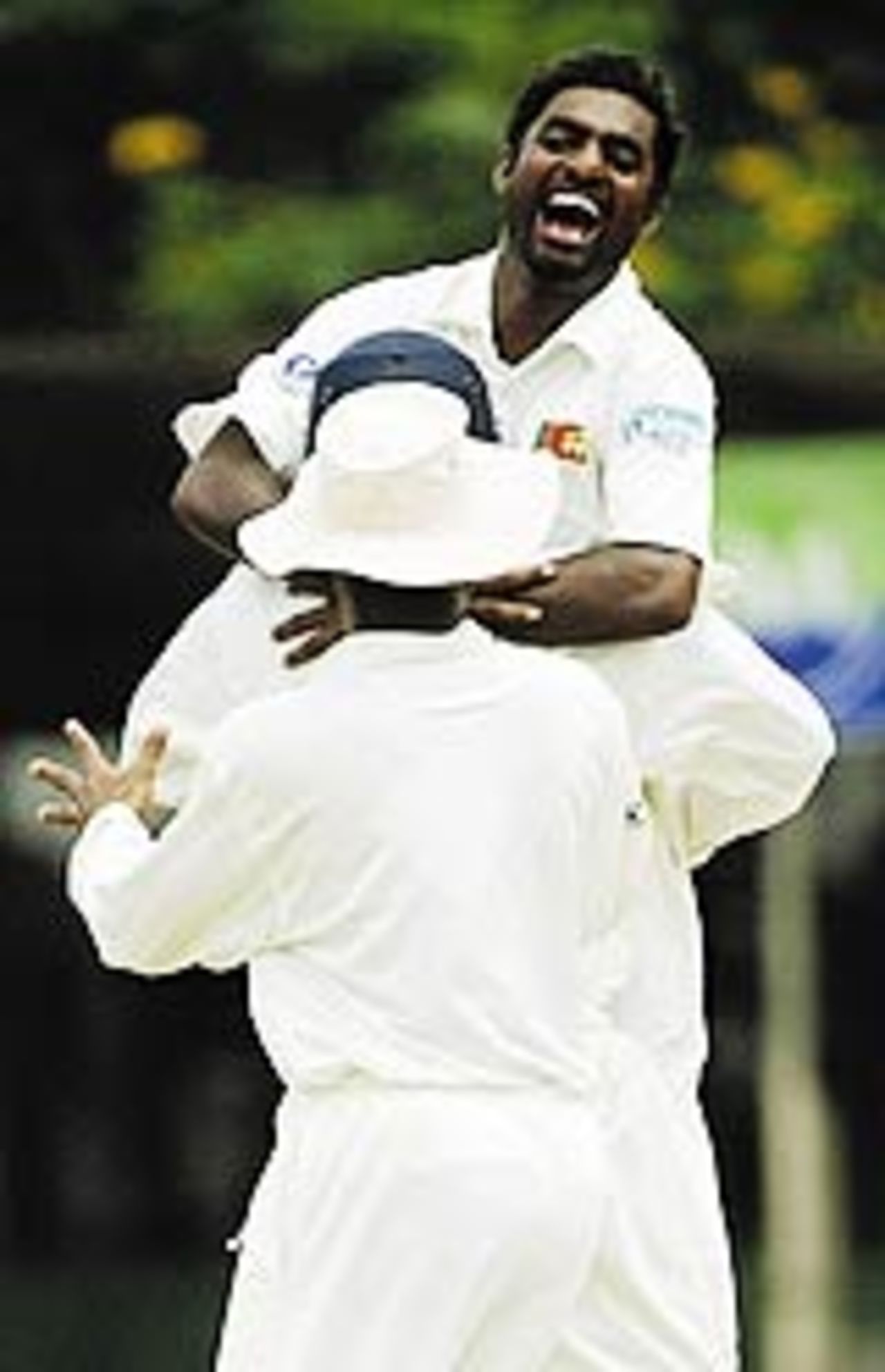 Muttiah Muralitharan celebrates his 500th Test wicket, Sri Lanka v Australia, 2nd Test, Kandy, 1st day, March 16, 2004