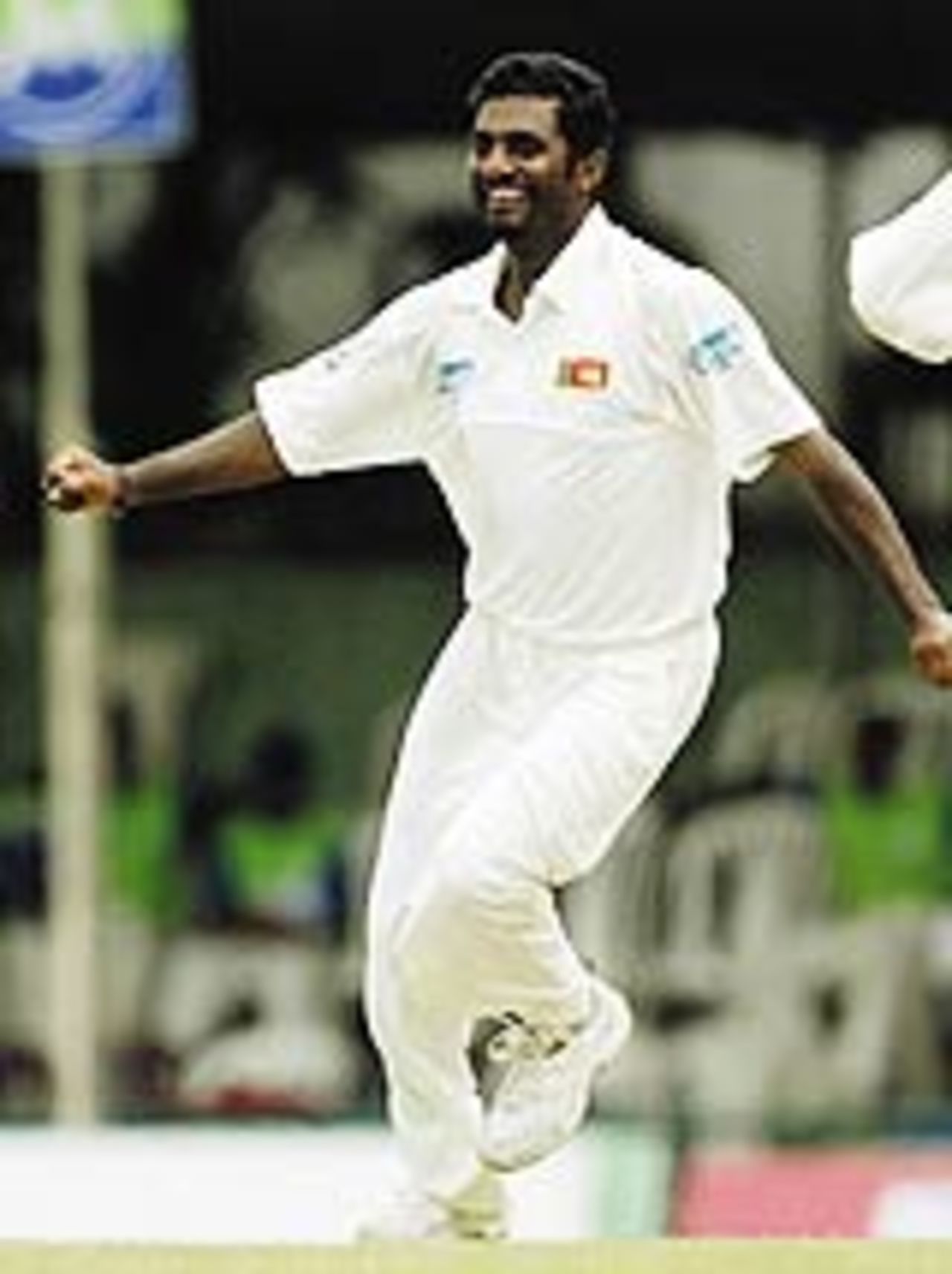 Muttiah Muralitharan rejoices after getting his 500th Test wicket, Sri Lanka v Australia, 2nd Test, Kandy, 1st day, March 16, 2004