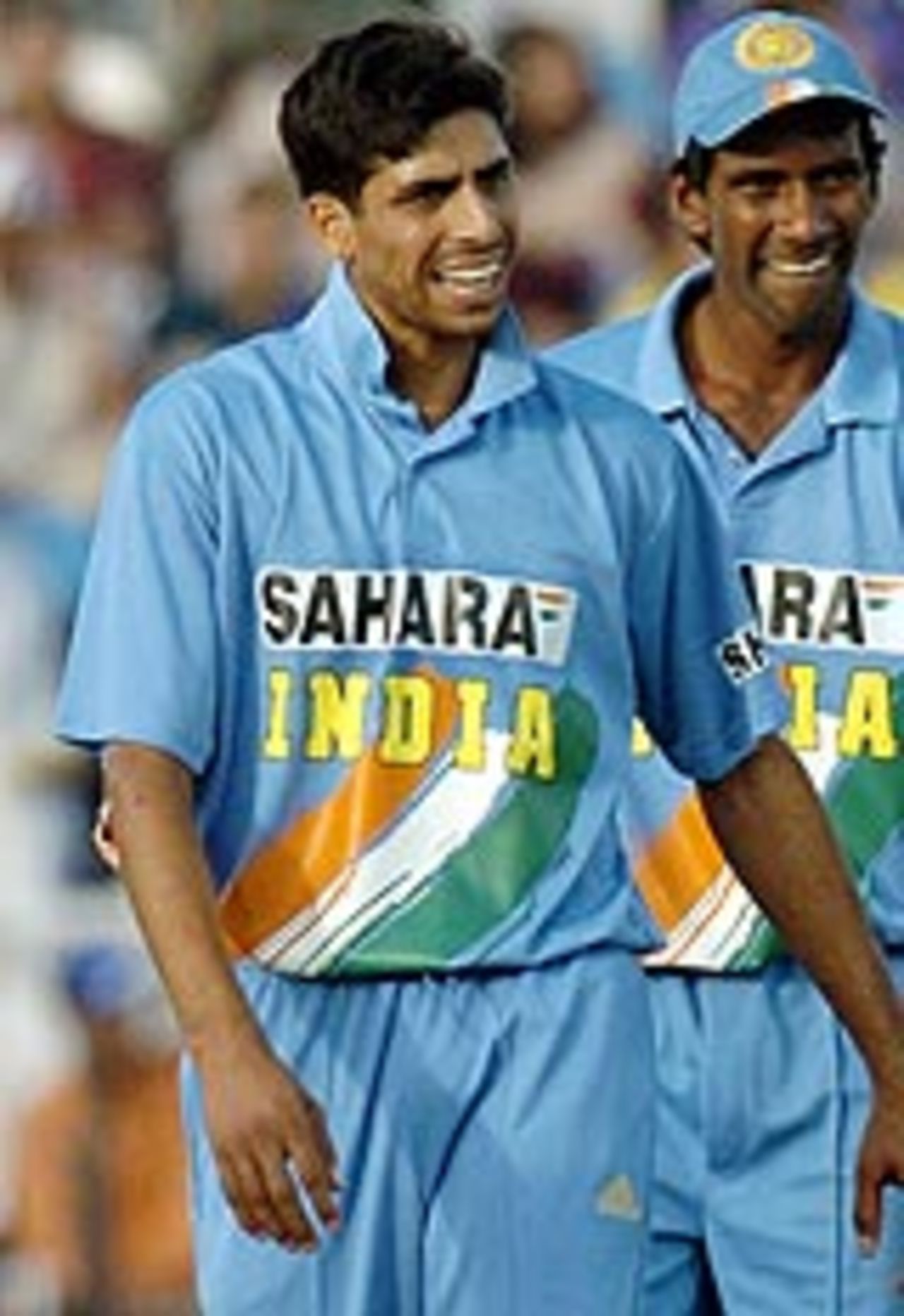 Ashish Nehra walks away after hurting his hand, with L Balaji in the background, Pakistan v India, 2nd ODI, Rawalpindi, March 16, 2004