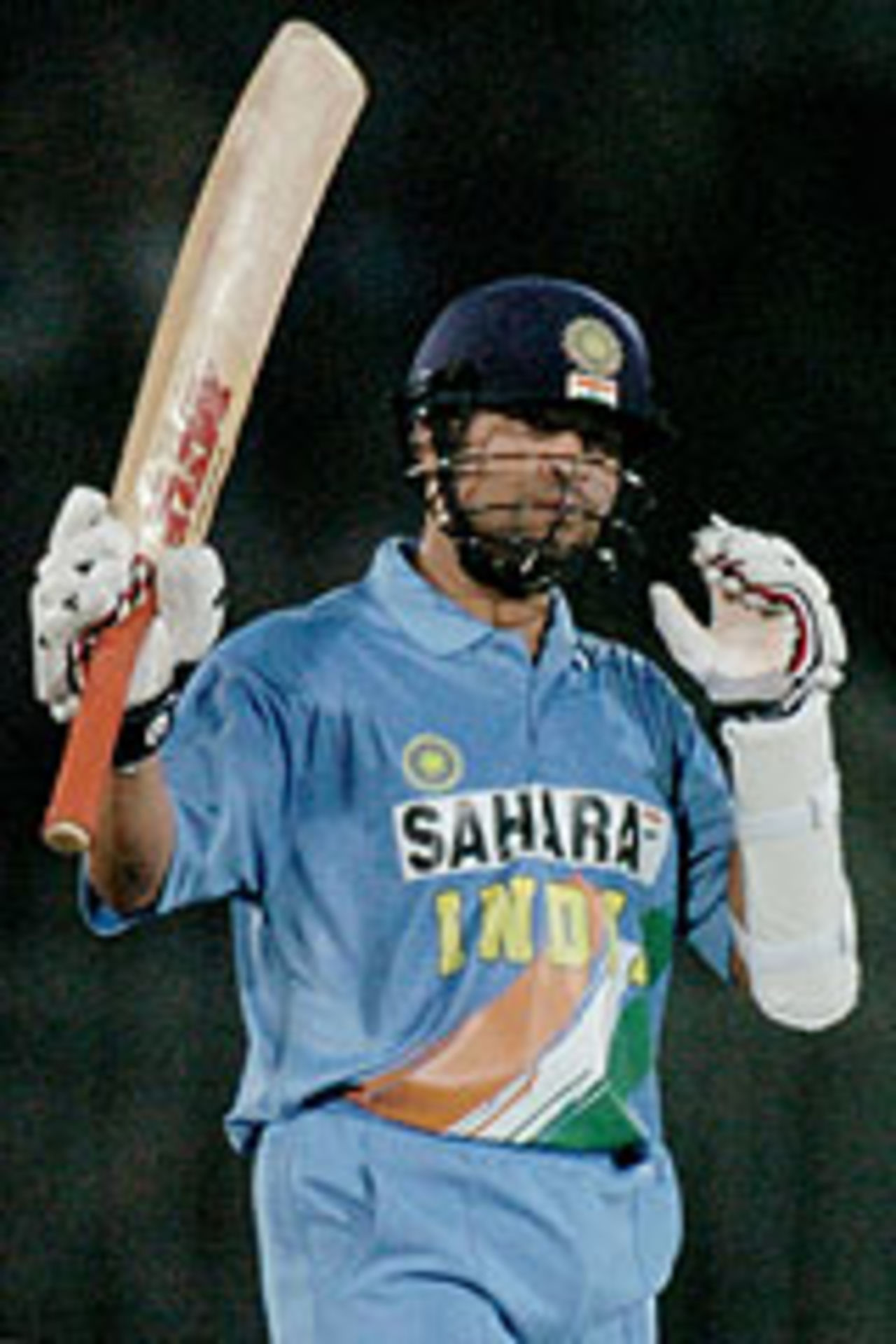 Sachin Tendulkar raises his bat after reaching a century, Pakistan v India, 2nd ODI, Rawalpindi, March 16, 2004