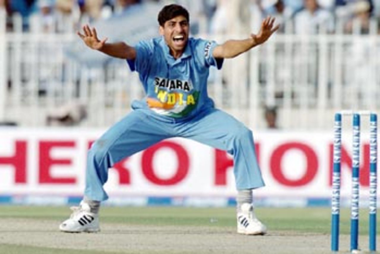Indian pace bowler Ashish Nehra successfully appeals for an LBW decision aganist Pakistani batsman Moin Khan