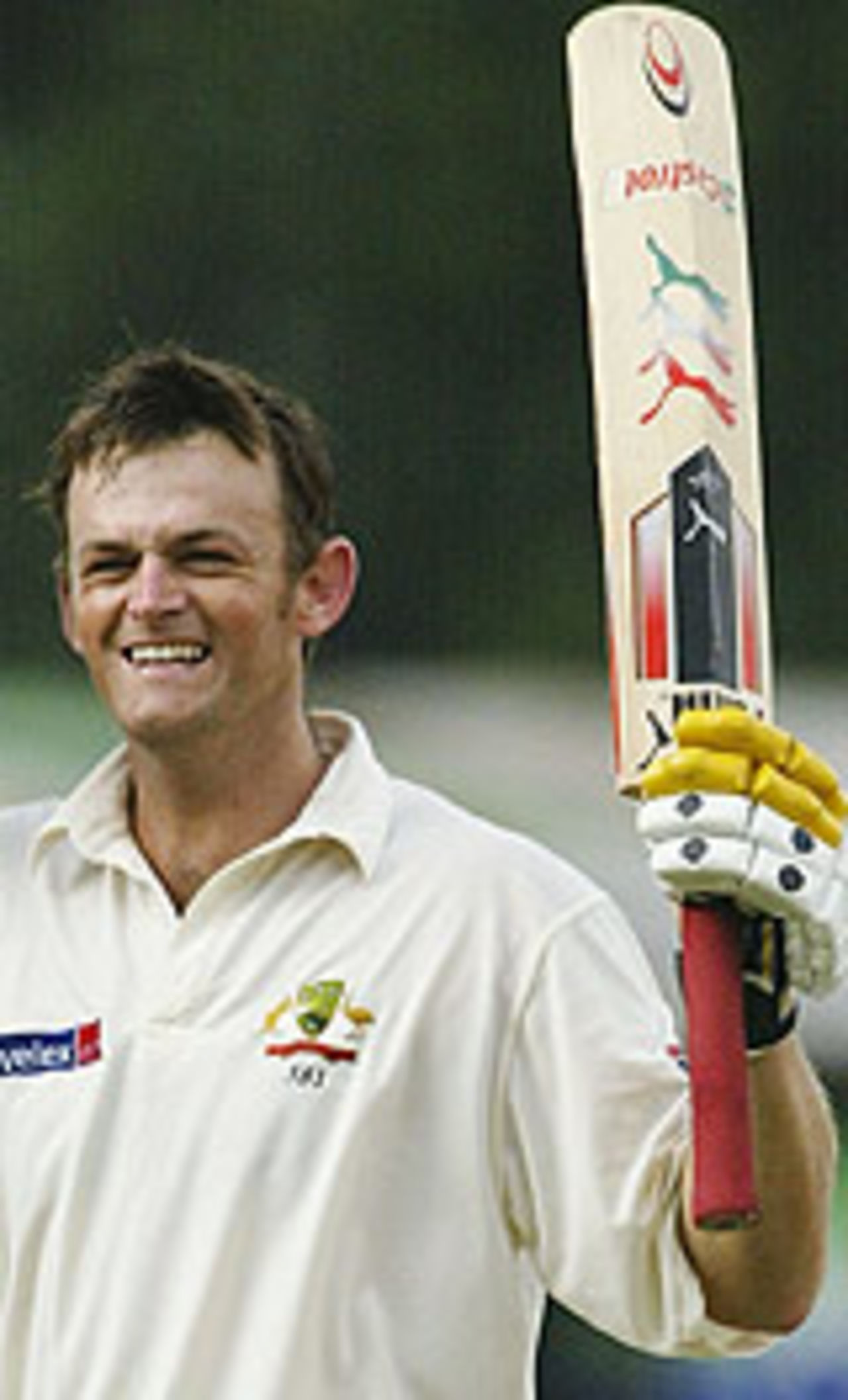 Adam Gilchrist raises his bat on reaching his century, Sri Lanka v Australia, 2nd Test, Kandy, 2nd day, March 17, 2004