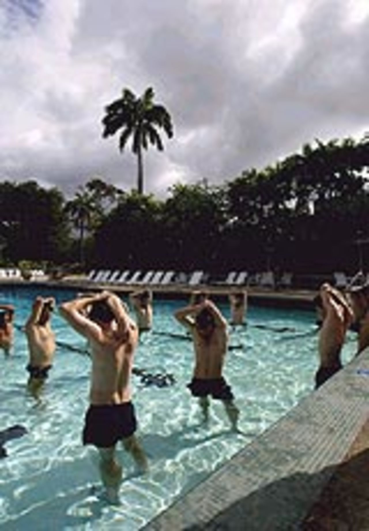 England's cricketers warm up in the pool in Trinidad, March 17, 2004