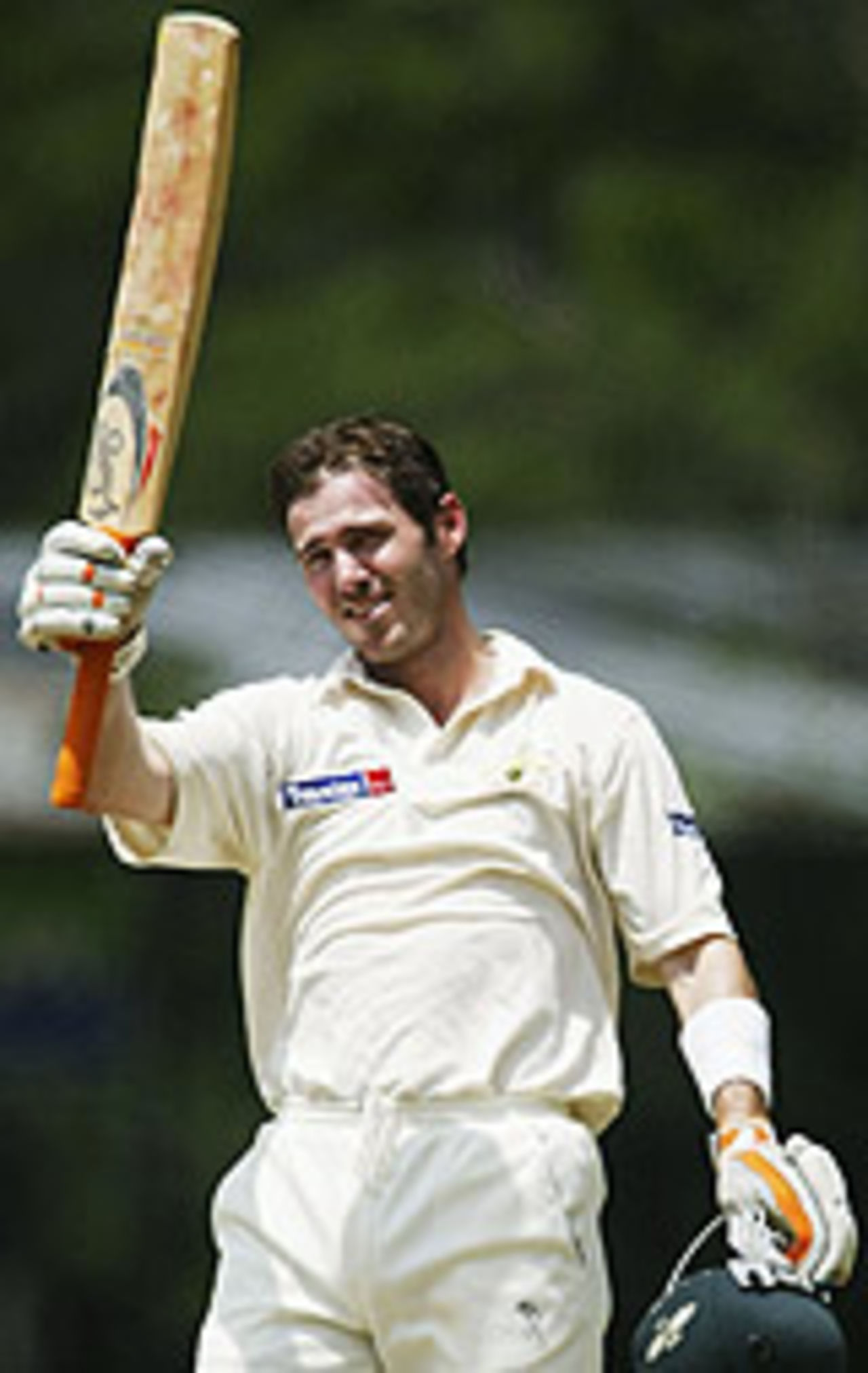 Damien Martyn raises his bat on reaching his century, Sri Lanka v Australia, 2nd Test, Kandy, 2nd day, March 18, 2004