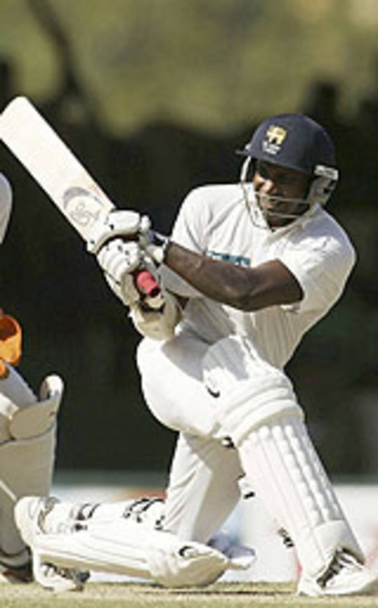 Sanath Jayasuriya sweeps during his hundred, Sri Lanka v Australia, 2nd Test, Kandy, 3rd day, March 19, 2004