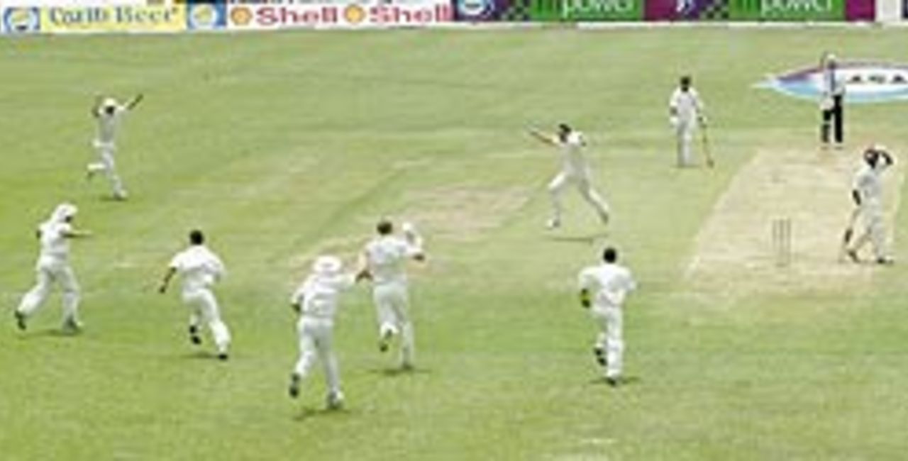 Umpire Bowden lifts his finger, Lara holds his head, Giles takes the catch and all England celebrates